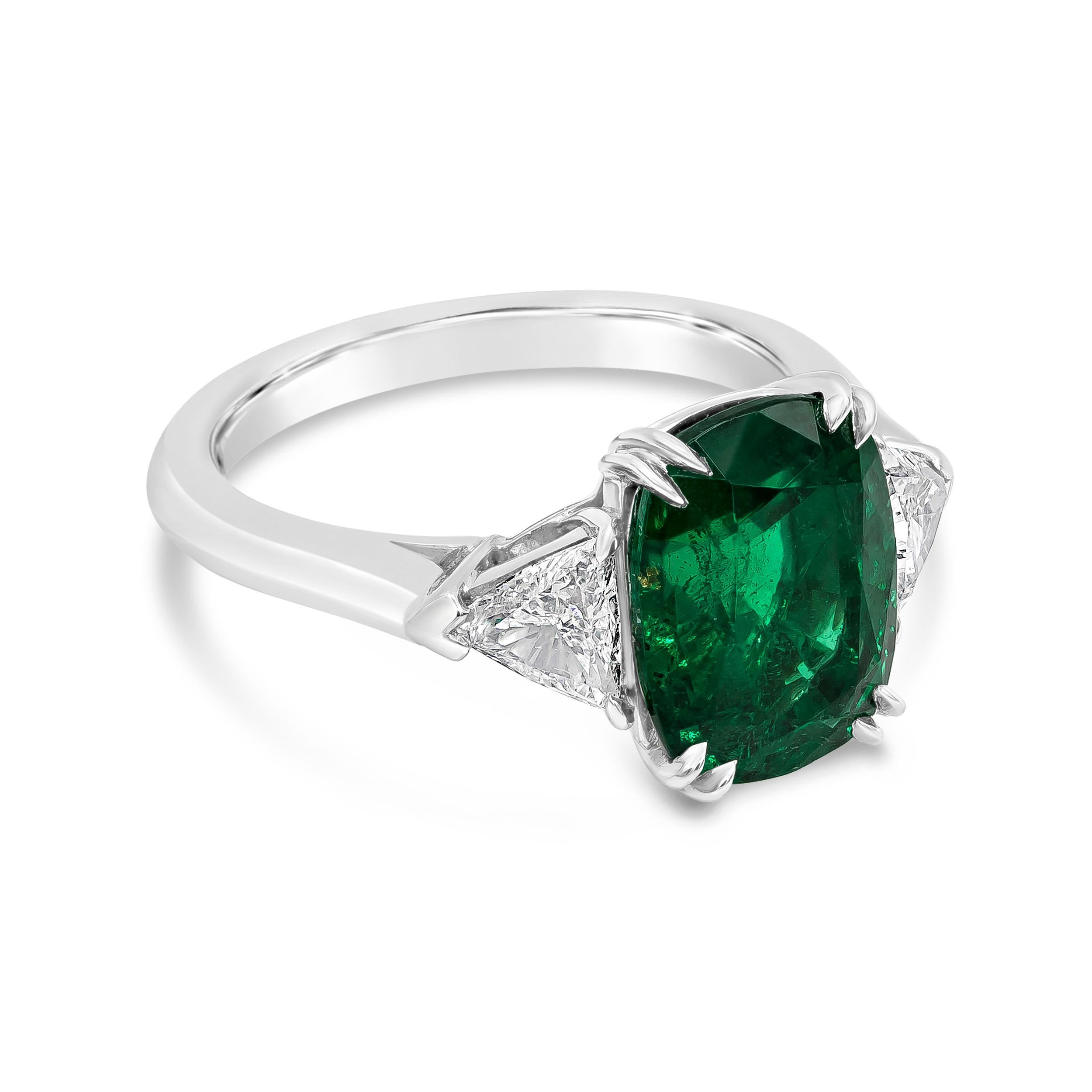 An engagement ring rich in color. Features a GIA certified 3.76 carat Cushion cut green emerald , set in eight prong platinum basket. Flanked by trillion diamonds on each side weighing 0.6 carat total.

Style available in different price ranges.