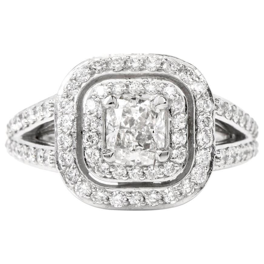 This stunning diamond engagement ring is crafted in solid platinum. Displaying a prominent four prong set cushion modified brilliant GIA certified diamond approx. 0.81 carat, H color, VS1 clarity. Surrounded by a double halo and split shank of pave