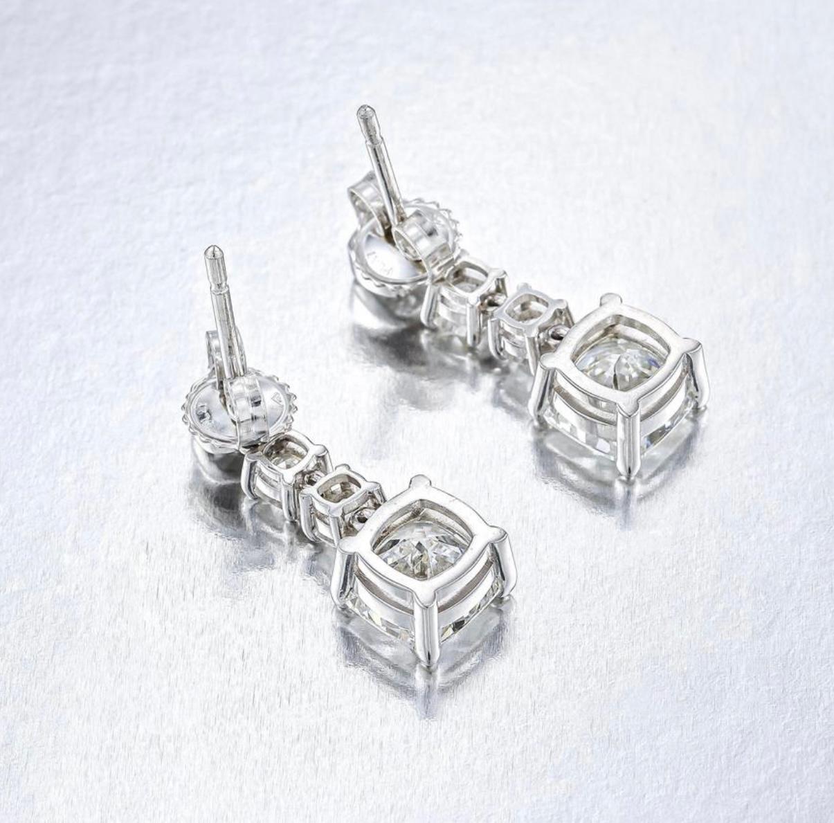 GIA Certified Cushion Diamond Three Stone Dangle Earrings In Platinum. For Sale 2