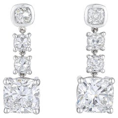 GIA Certified Cushion Diamond Three Stone Dangle Earrings In Platinum.