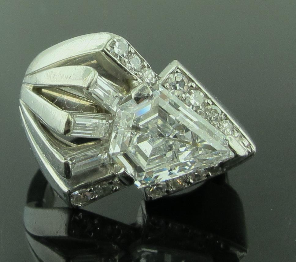 GIA Certified 1.85 carat Shield Cut diamond, D in color and VS1 in clarity, including 3 side baguettes and 14 single cut diamonds with a total weight of 0.20 carats.  The ring is set in Platinum and 14 karat white gold. 8 grams in weight.  Ring size