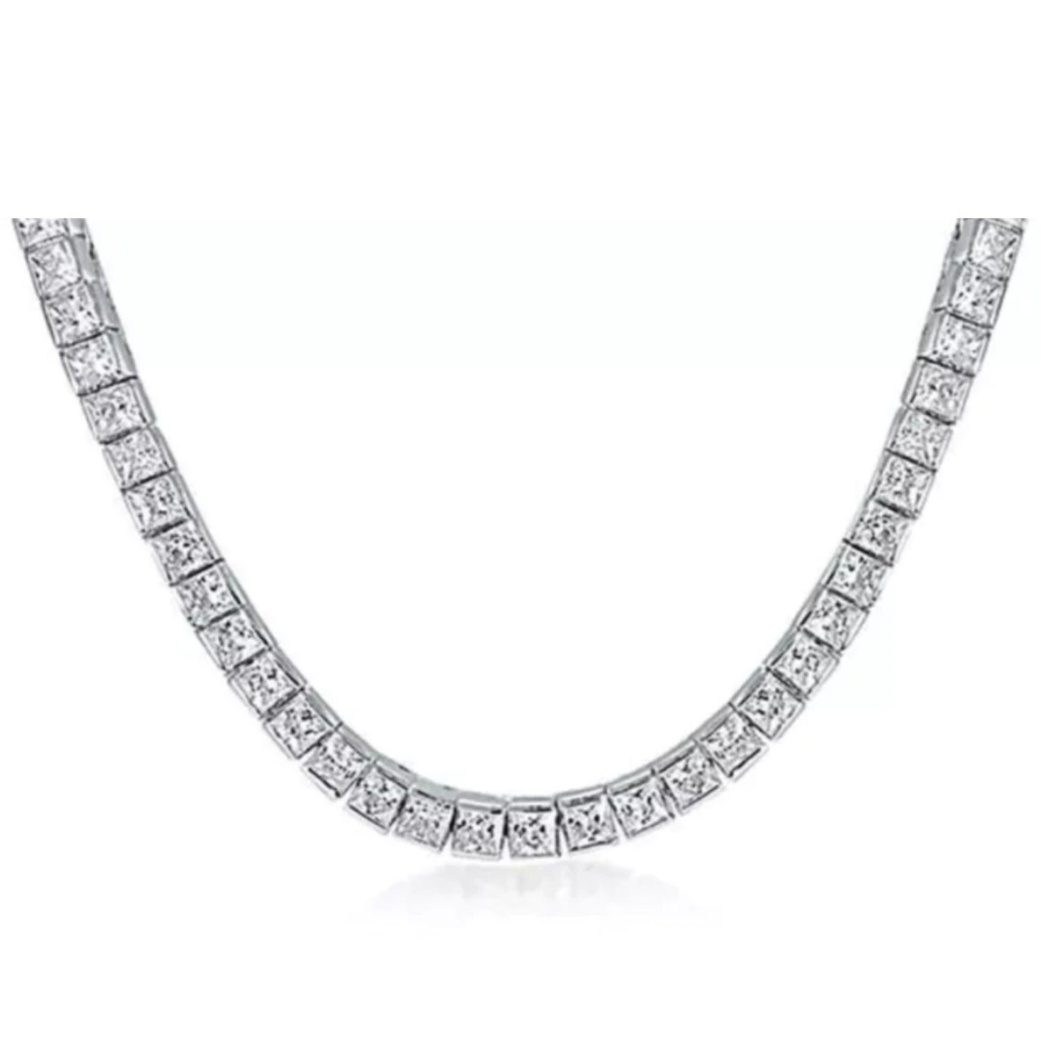 A stunning, 91 piece Princess Cut Diamond Tennis Necklace, weighing 28.82 carats total. 
The necklace is set in 18K White Gold, and each Diamond is GIA certified, all D/E color, VVS/VS quality. 
