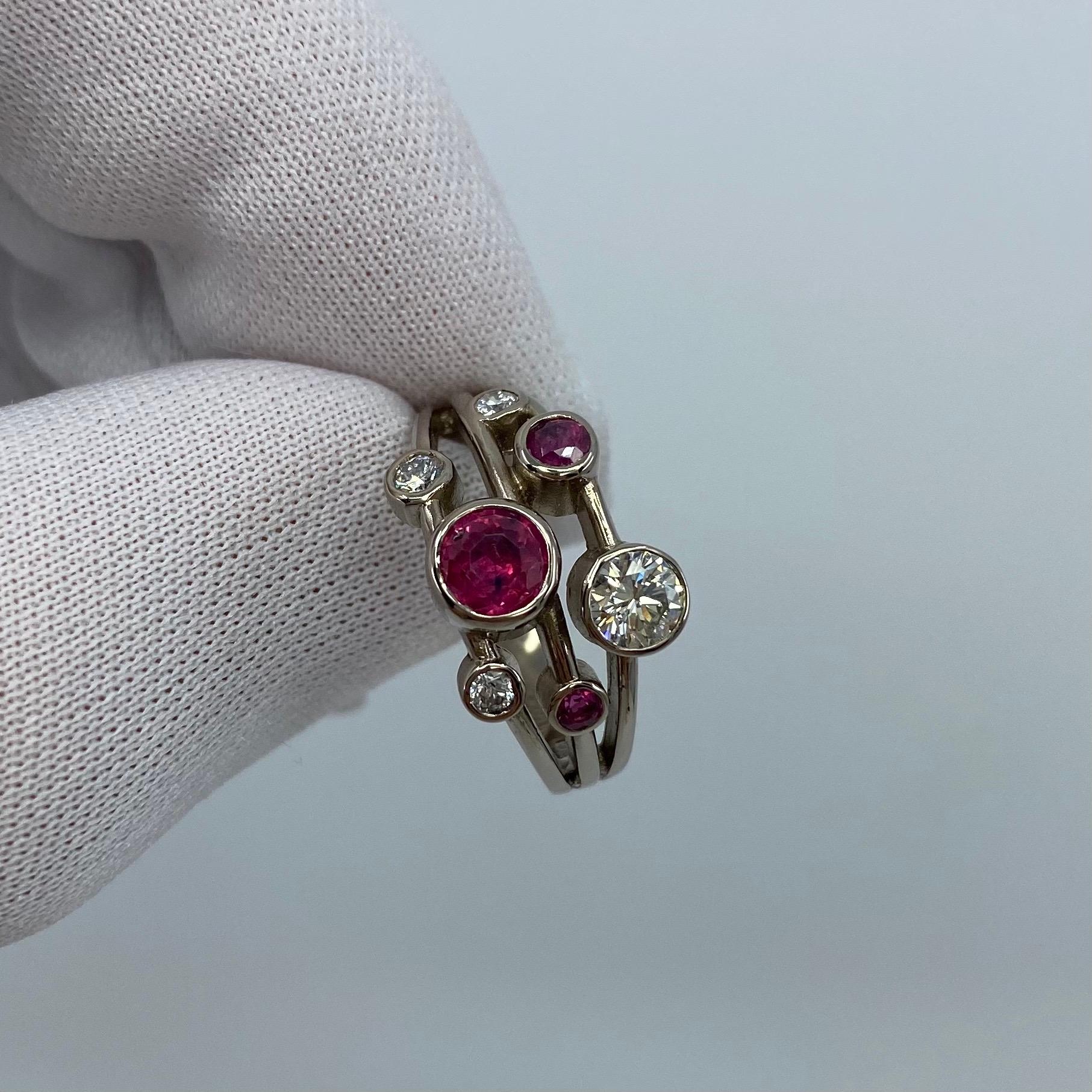 1.27 Total Carat Diamond & Ruby Raindance-Style 18k White Gold Ring.

A beautiful 18k white gold ring set with 4 round brilliant cut white diamonds and 3 round cut natural red rubies.
The largest diamond is a GIA Certified 0.30ct with VS2 clarity