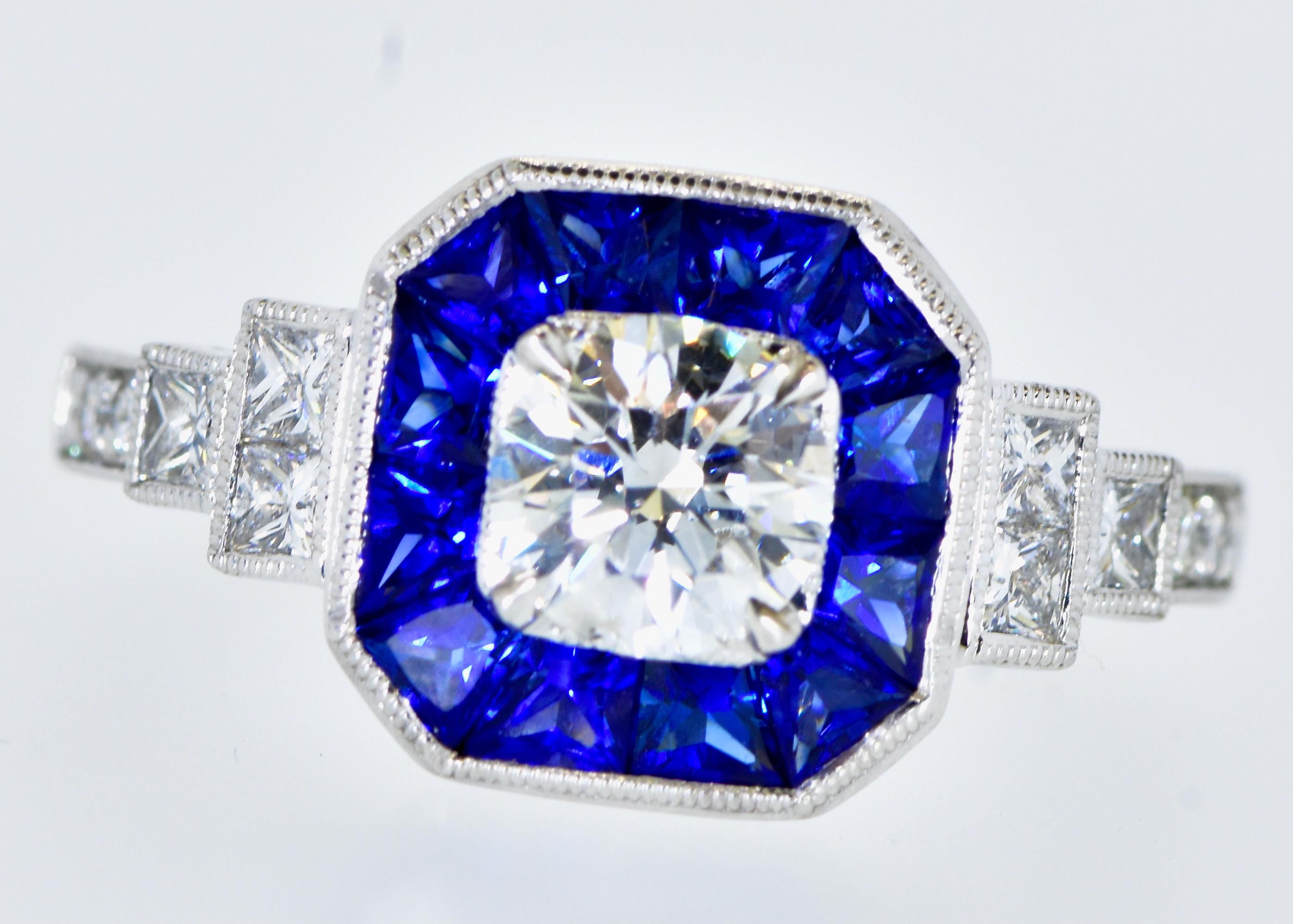 Sapphire and Diamond white gold contemporary new ring.  18K (marked 750), white gold well made ring possessing 12 fancy cut natural excellent color bright blue sapphires - not too light nor too dark - weighing an estimated 1.0 cts.  the 12 smaller
