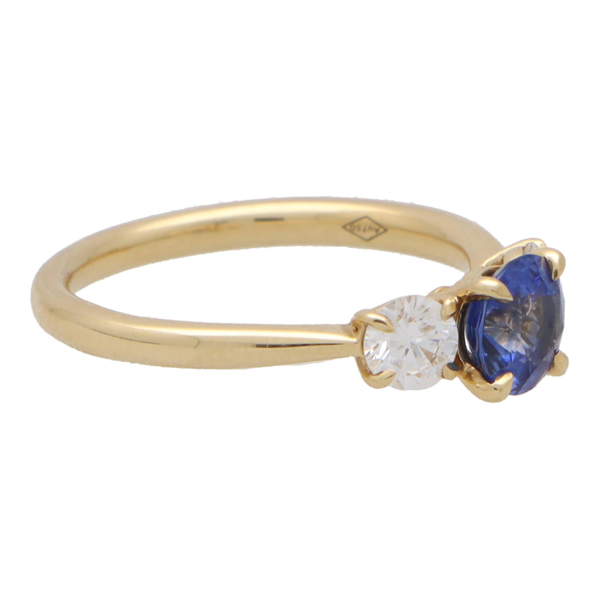 Round Cut GIA Certified Diamond and Sapphire Three Stone Ring in 18k Yellow Gold For Sale