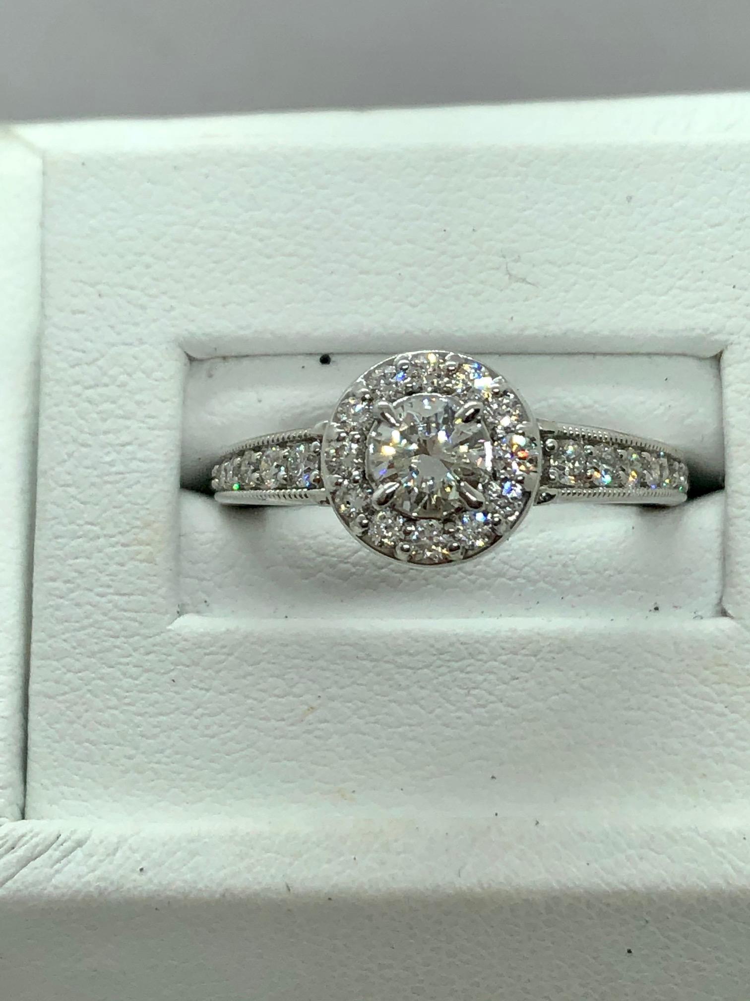 DIAMOND ENGAGEMENT RING 0.91 CARAT TOTAL WEIGHT SET IN 14KWG G VVS1 GIA

Round Diamond Center Stone 0.41 carats 
 

