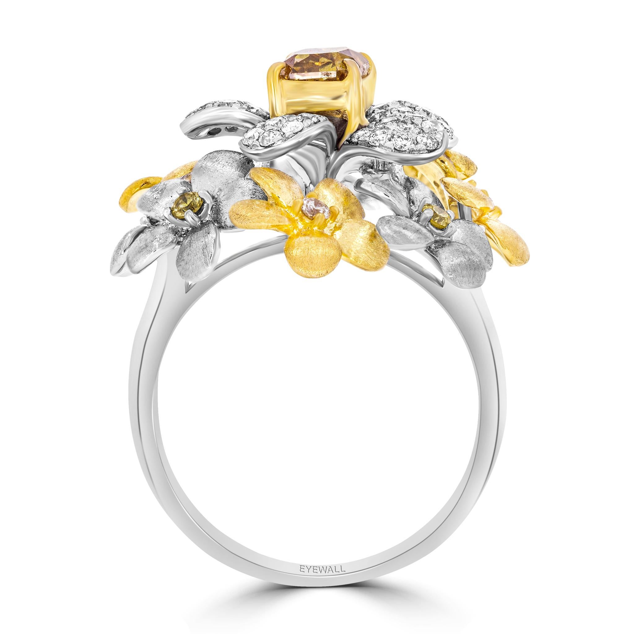 Bloom into elegance with this GIA certified diamond dress ring from bo•be jewellery. At its heart, a radiant fancy brown yellow diamond nestles in a four-claw setting, enhanced by a nano-enamel coating for added brilliance. Surrounding this