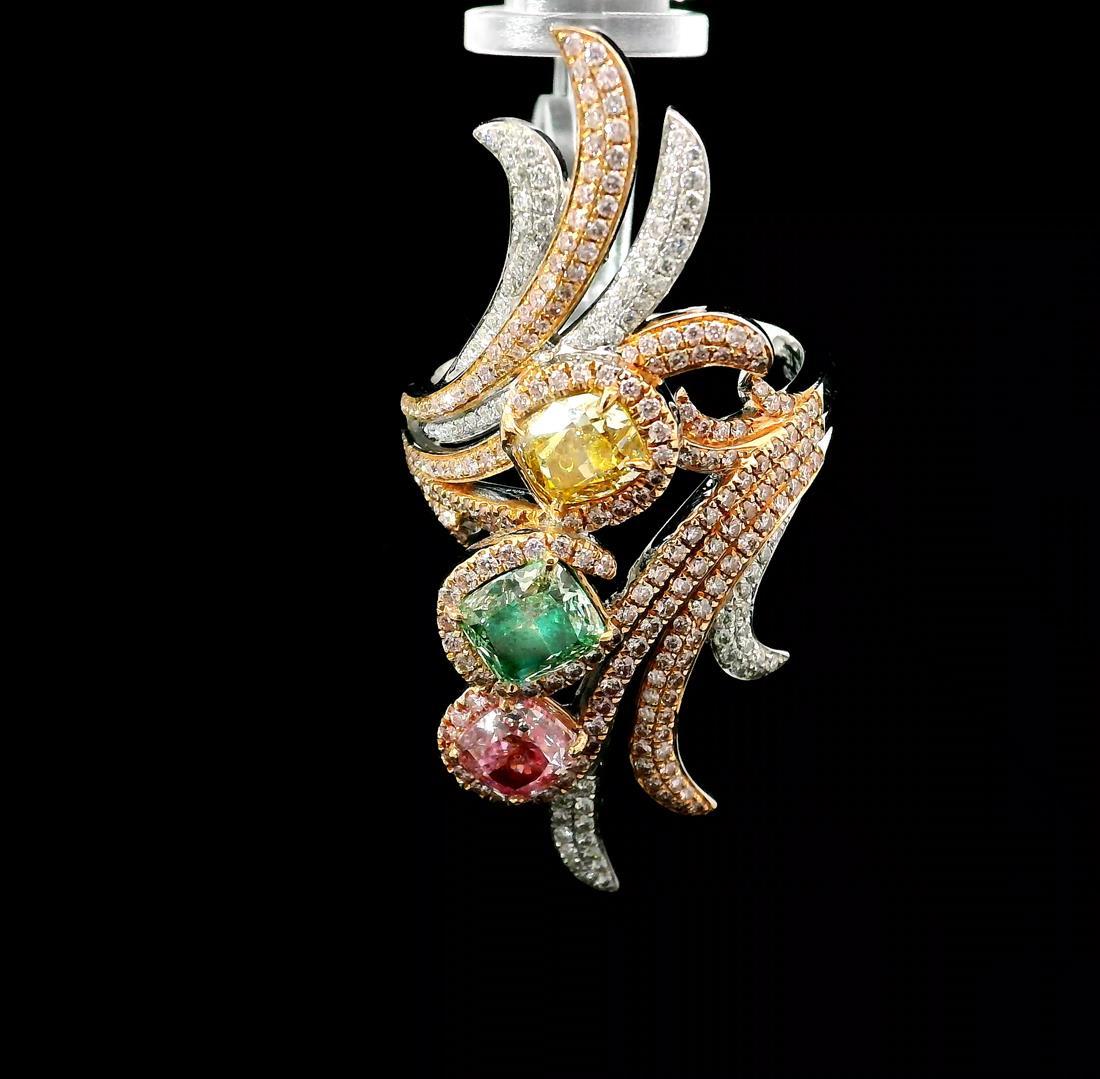 18kt white gold ring with diamonds
  
  Gold colour & karat: White gold 18kt
  Weight: 6.15 grams
  
  Set with-
  Stone type: Diamonds
  Shape: All Cushion
  Carat: 0.72 ct, 0.72 ct, 0.71 ct
  Colour: Fancy Light Yellow, Faint Pink, Fancy Light