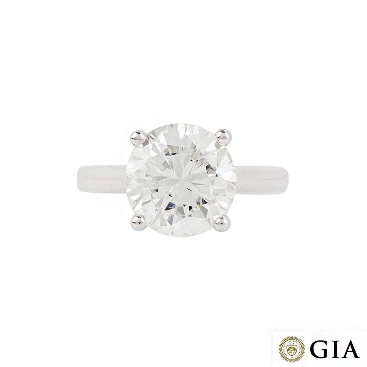 An exquisite diamond single stone ring in platinum. The 3.93ct round brilliant cut diamond is set in a timeless four claw setting, the colour is H and the clarity is VS1. The 3mm tapered ring is currently a UK size M, US size 6, but can be adjusted