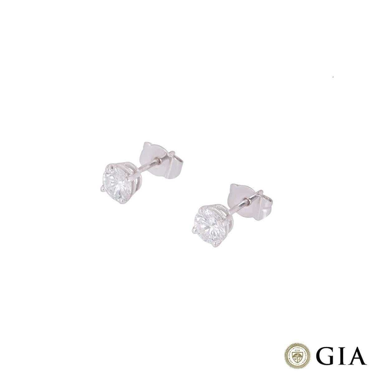 A beautiful pair of 18k white gold diamond stud earrings. The earrings comprise of a single round brilliant cut diamond in a four claw setting, one weighing 0.50ct, G colour and VVS1 in clarity and the other 0.51ct, G colour and VS1 clarity. The