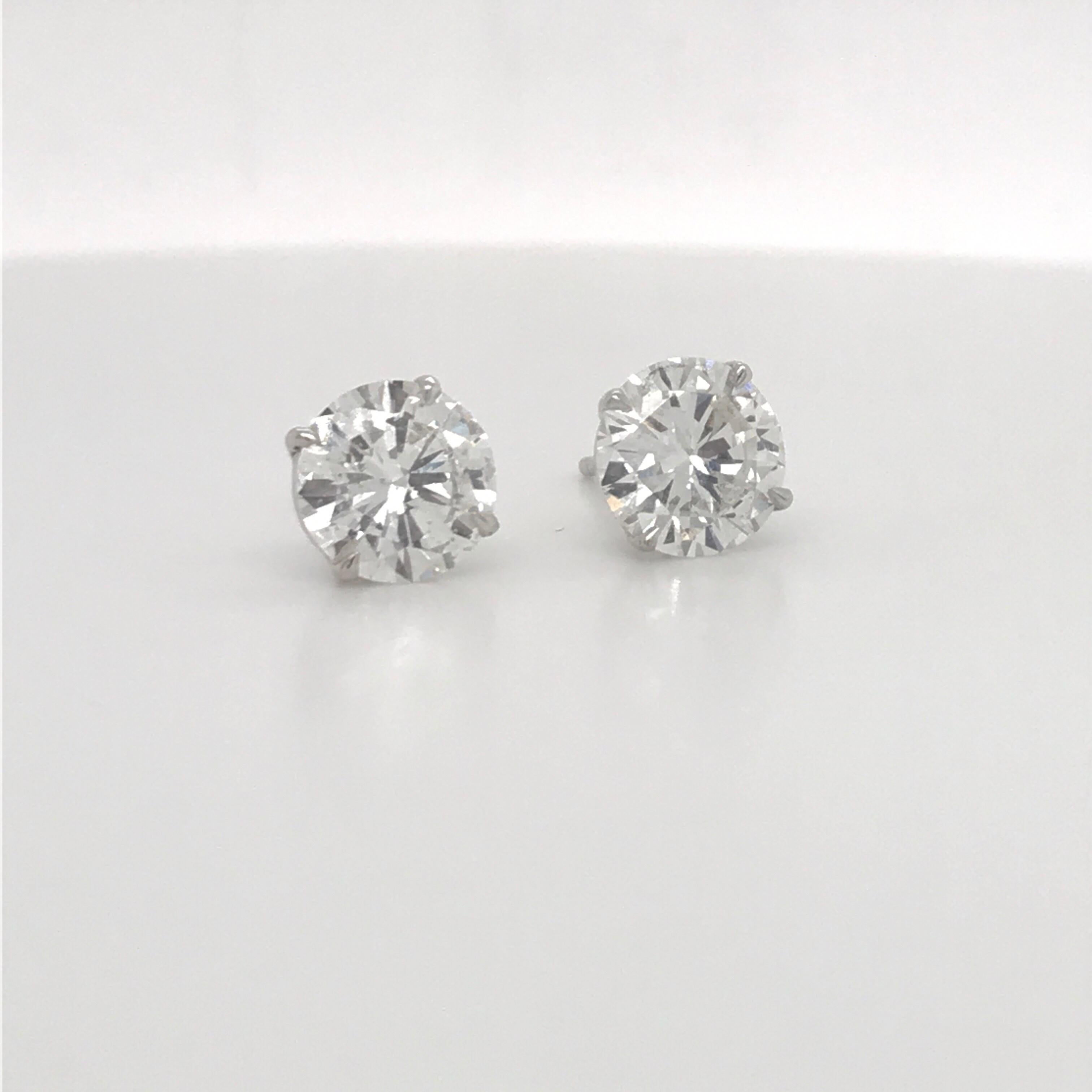 GIA Certified diamond stud earrings weighing 2.82 carats in a 4 prong champagne setting, 18k white gold.
Color H
Clarity SI2-I1