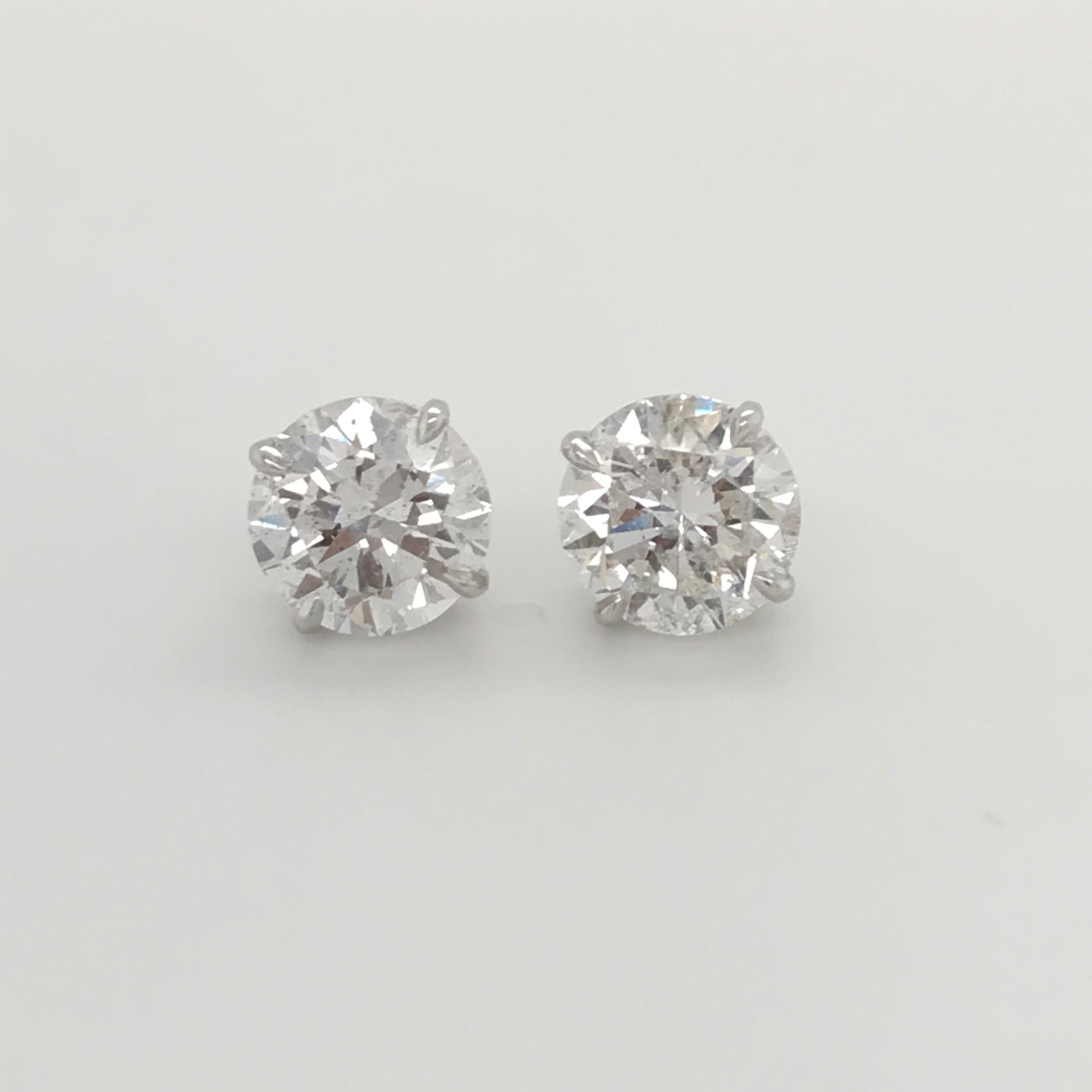 GIA Certified Diamond Stud Earrings weighing 4.71 Carats.
Color: E-F
Clarity: I1-I2
4 Prong Classic Setting 

Harbor Diamonds specializes in diamond studs, tennis bracelets and riviere necklaces. 