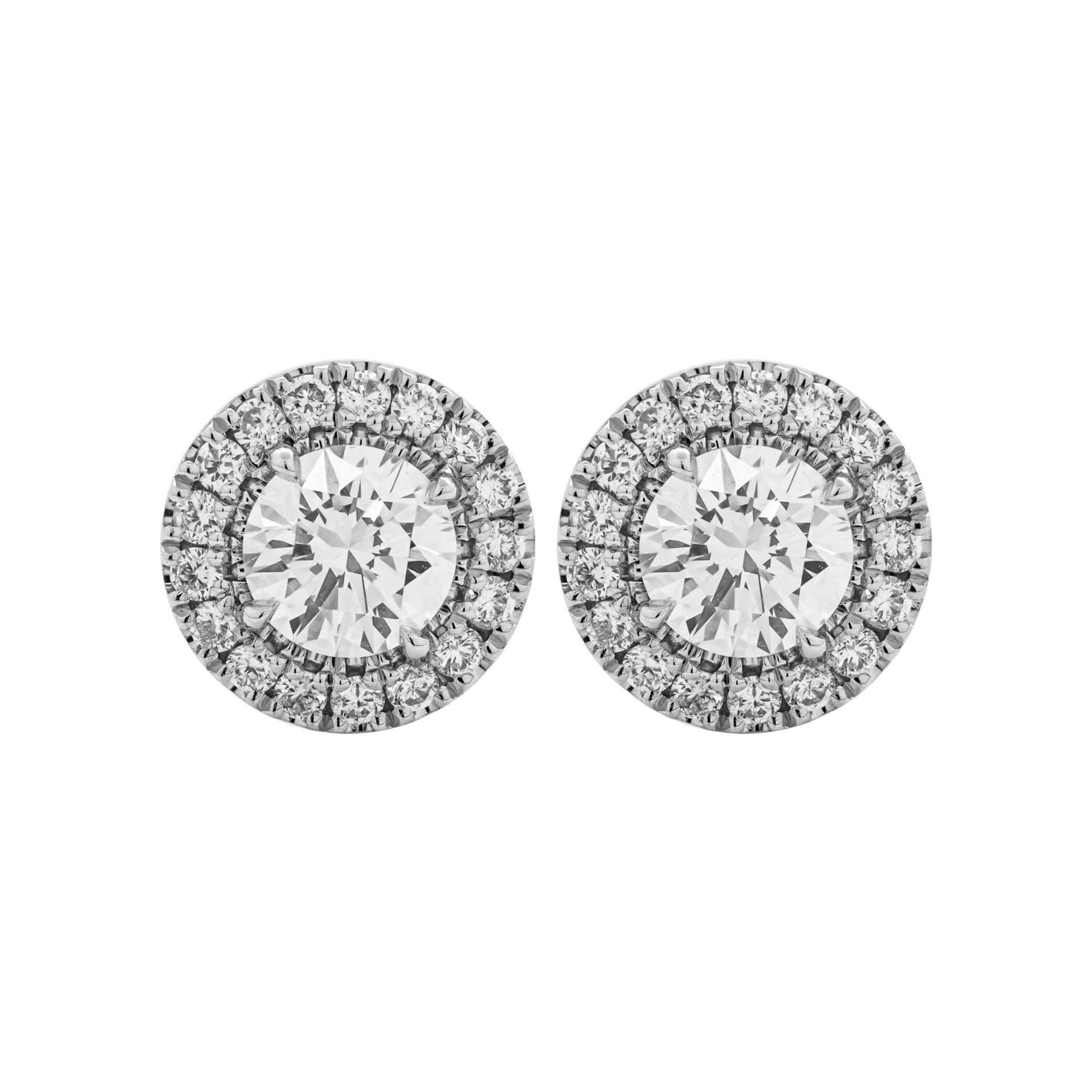 Classic design that is essential addition to any jewelry collection, a true staple!
Nice and delicate halo around center stone diamonds make stones appear larger, looks like a true 1 carat.
Each stone is 0.60ct and GIA certified:
0.60ct G VS1 Round