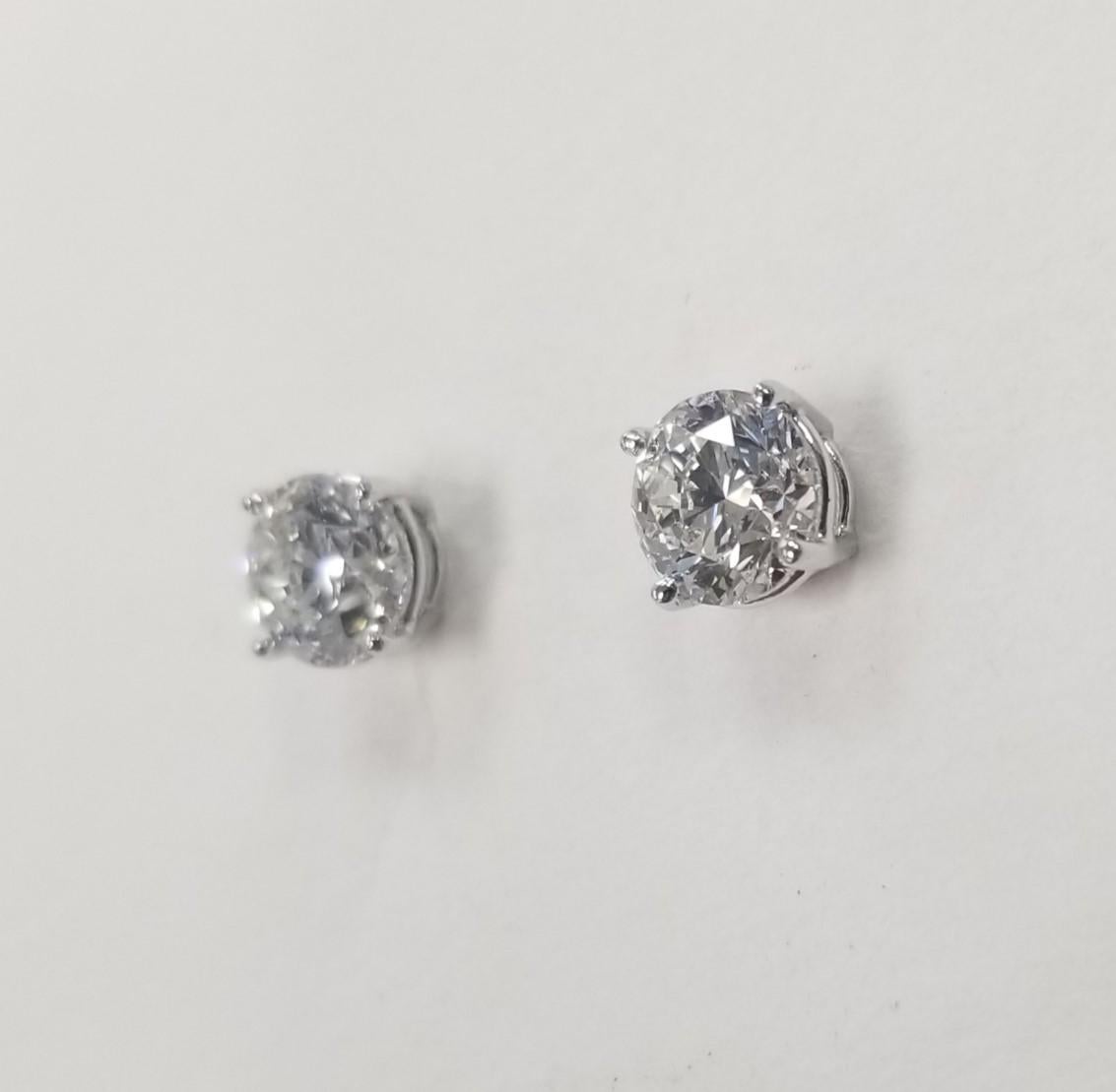 Diamond stud earrings, containing 2 GIA Certified brilliant cut diamonds; color 