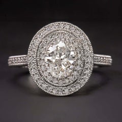 GIA Certified Diamond Surrounded by a Glittering Double Diamond Halo