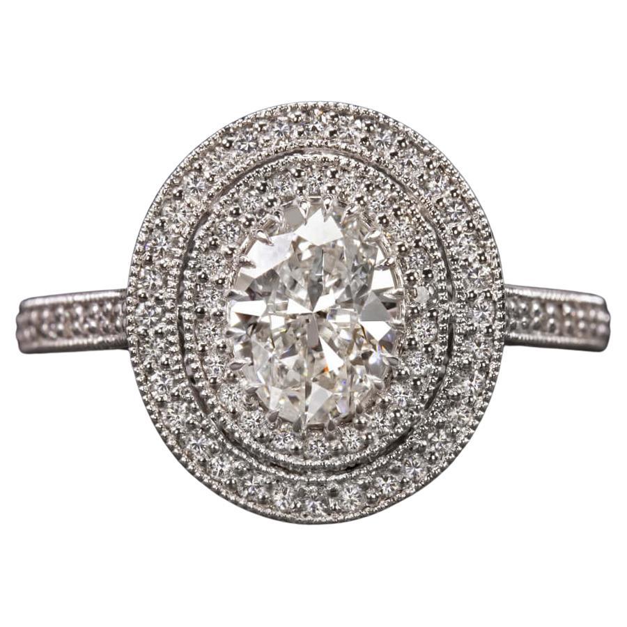 GIA Certified Diamond Surrounded by a Glittering Double Diamond Halo For Sale