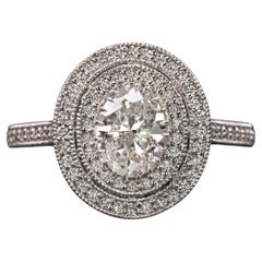 GIA Certified Diamond Surrounded by a Glittering Double Diamond Halo