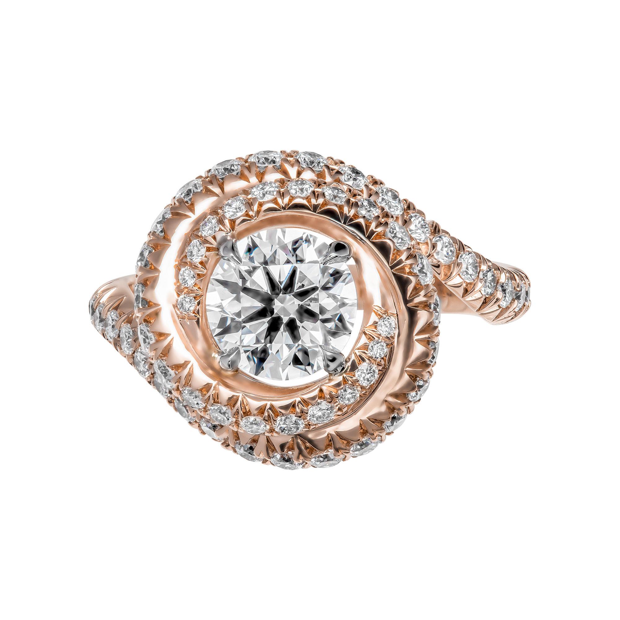 Dazzling and elegant , Mounted in 14K Rose Gold , this ring features exceptional french pave work. Encrusted all over, creating a beautiful swirl that hugs Round Diamond center stone
Ring Encrusted with almost 1 catar of full brilliant cut pave