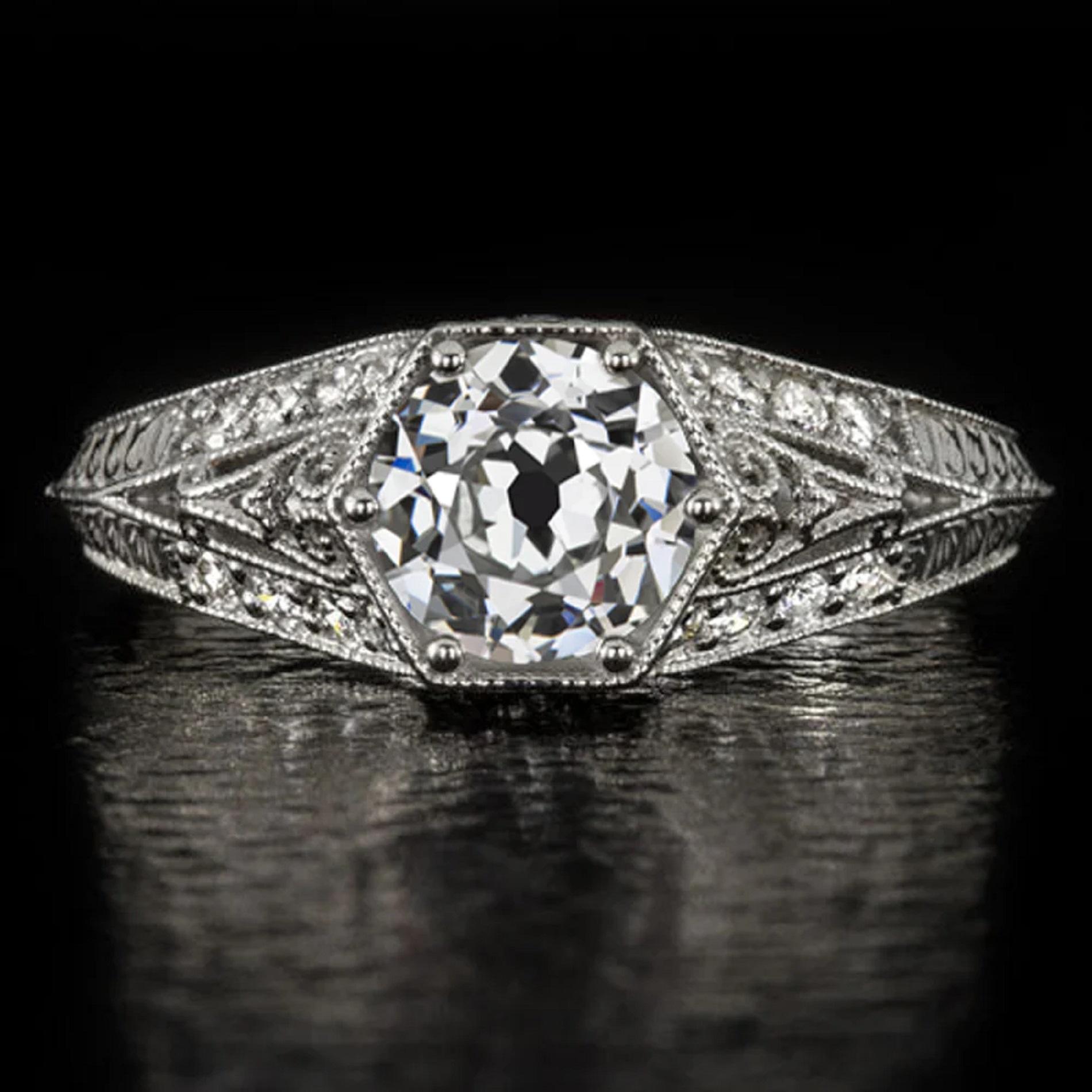 vintage style diamond ring is romantic and gorgeously detailed with filigree curls, engraved details, and glittering diamond accents! The 1.00ct old European cut center diamond is meaningfully historied and gorgeously brilliant!

Highlights:

-