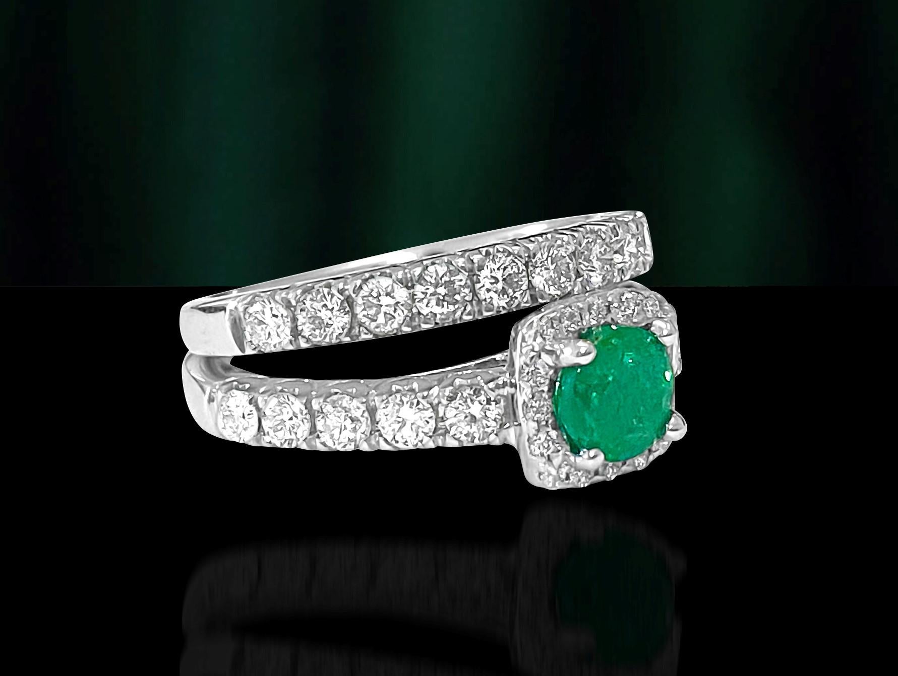 Metal: 14K white gold. 
Diamond carat weight total: 1.20 carats. Round brilliant cut. VS2-SI1 clarity and F color.

Emerald: 0.60 carats. Round cut. Colombian Emerald set in prongs. 

Total carat weight of all precious stones: 1.80 cts.
 
Total