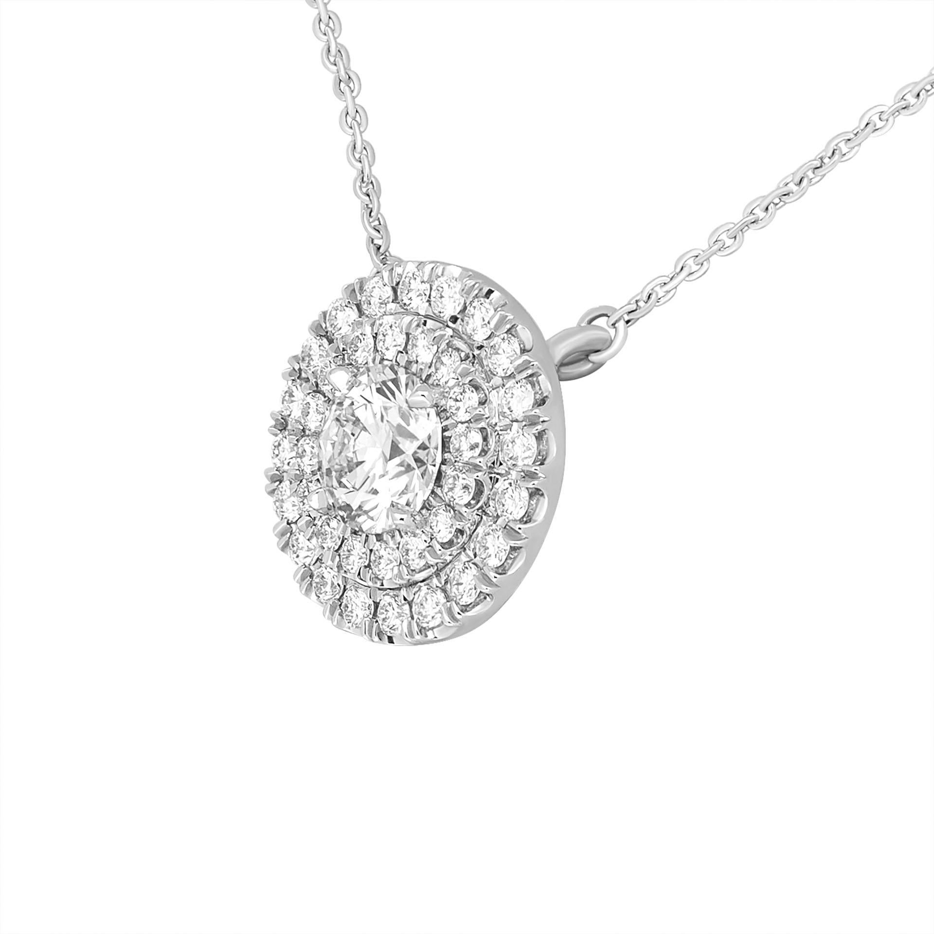 GIA Certified Double Halo Round Shaped Diamond Pendant in Platinum
With flower detailing on the back 
Center stone: 0.90ct D VVS2 Round shape Diamond GIA#2136880932 
Total carat weight of pave: 0.62ct (F/G VVS)