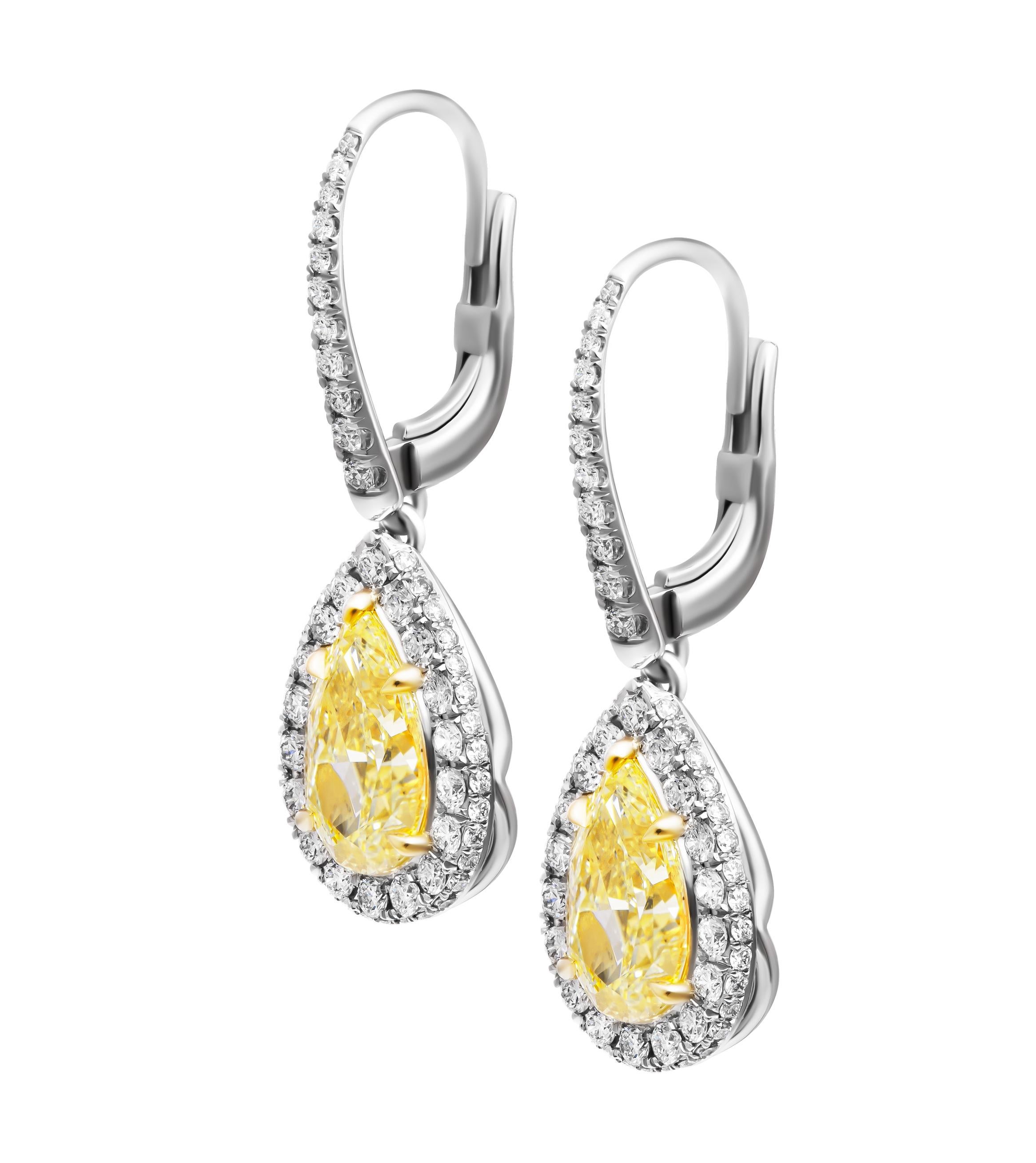 GIA Certified Drop Earrings with Fancy Light Yellow Pear Shape Diamonds
Mounted in 18K Yellow Gold & Platinum
With White Diamond Halo & Pave Leaver Backs

GIA Certified Matching pair of Fancy Light Yellow Pear Shapes:
2.26CT Pear Shape FLY VS1 GIA#