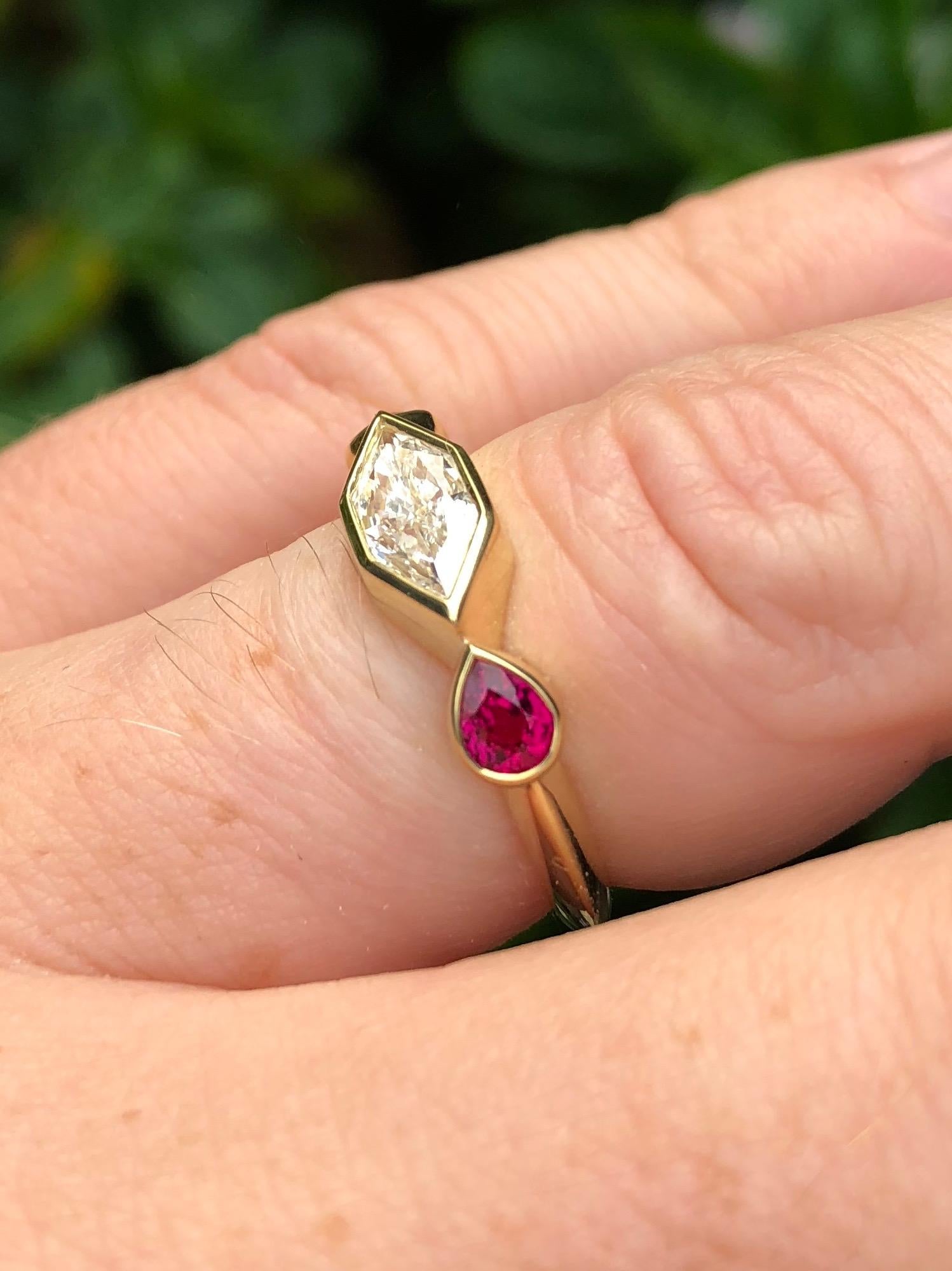 An engagement ring like no other. Made by hand (hand fabricated) in California with reclaimed and refined 18 karat gold, using saturated and stunning ethical rubies from Gemfields, and an exceptional GIA certified duchess cut diamond. This diamond