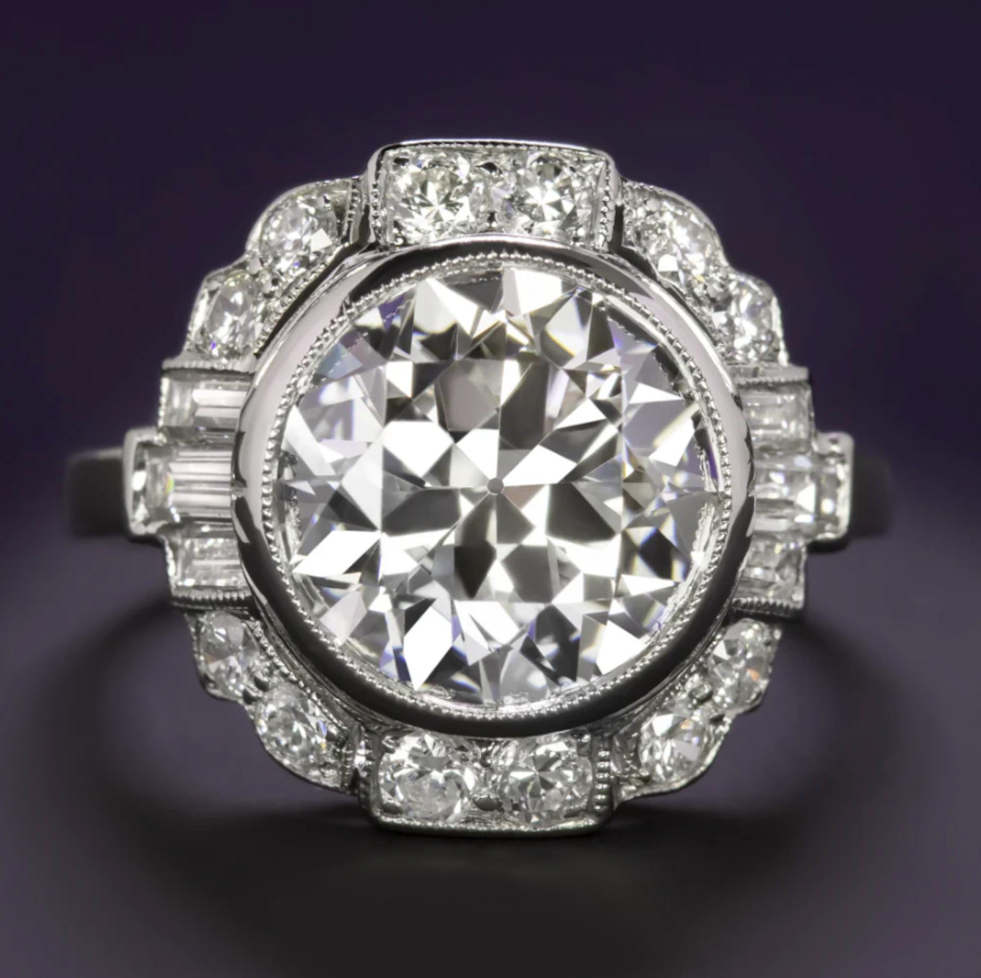 A breathtaking blend of vintage charm and modern craftsmanship, this exquisite engagement ring showcases a GIA certified 3.64 carat Old European cut diamond of E color and VS1 clarity, a truly rare and remarkable find.

The center stone is a