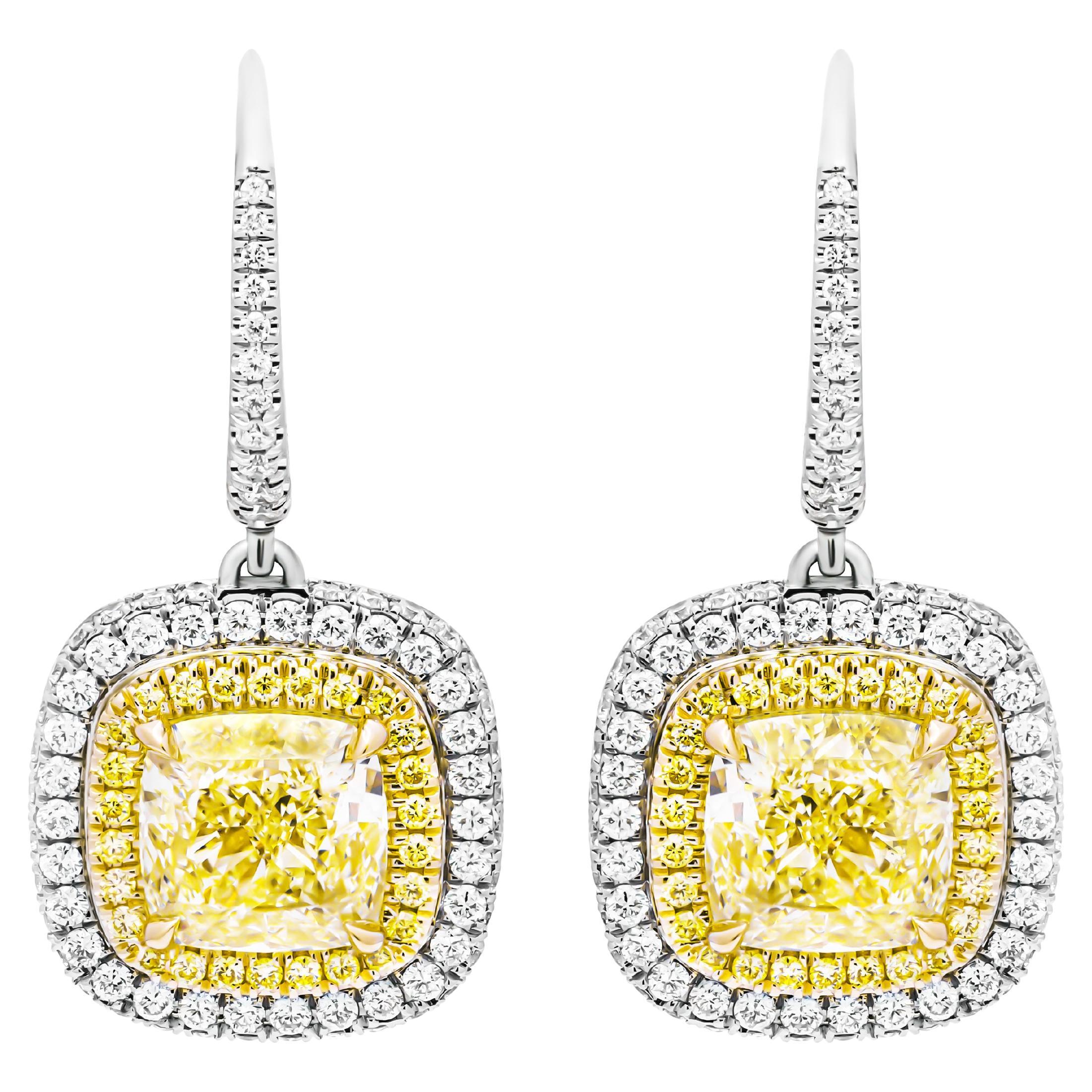 GIA Certified Earrings with 3 carat each Fancy Light Yellow Cushion Cut Diamonds For Sale