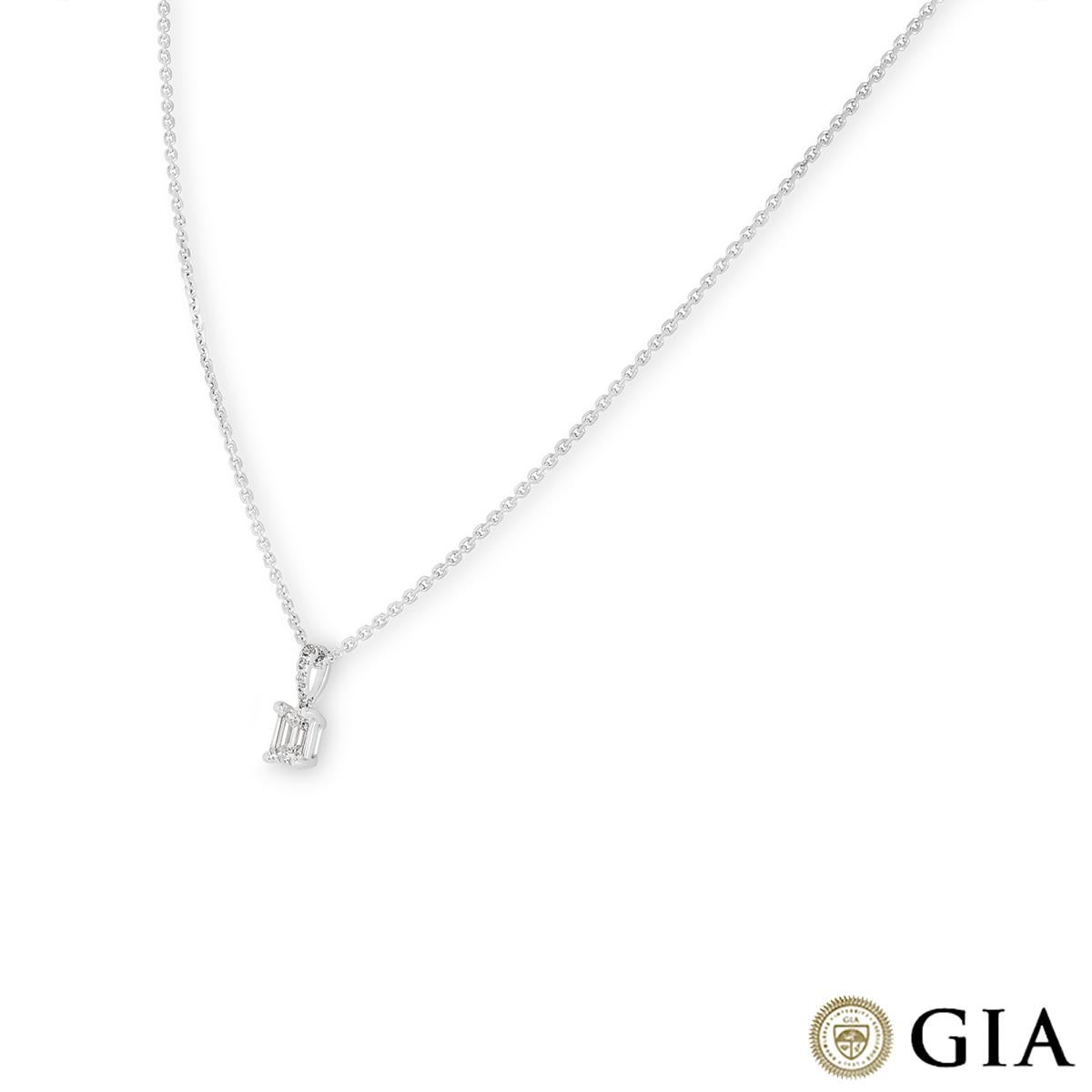 An exquisite 18k white gold diamond pendant. The pendant features an emerald cut diamond set in a four prong mount weighing 0.41ct, E colour and SI1 clarity. Further accentuating the centre diamond are 5 round brilliant cut diamonds pave set to the