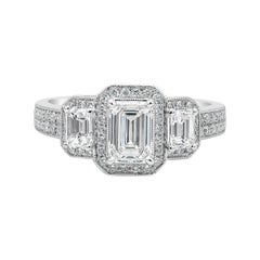 GIA Certified Emerald Cut Diamond Three-Stone Halo Engagement Ring