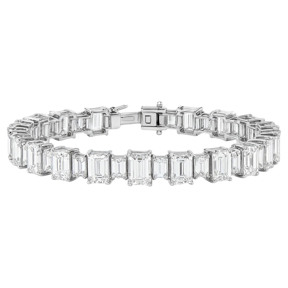 GIA Certified Emerald-Cut Diamonds, 27 Carats Total

A spectacular diamond line bracelet of exceptional craftsmanship, mounted in platinum and weighing 33.5 grams. The bracelet is composed of a series of 18 GIA-certified emerald-cut diamonds with a