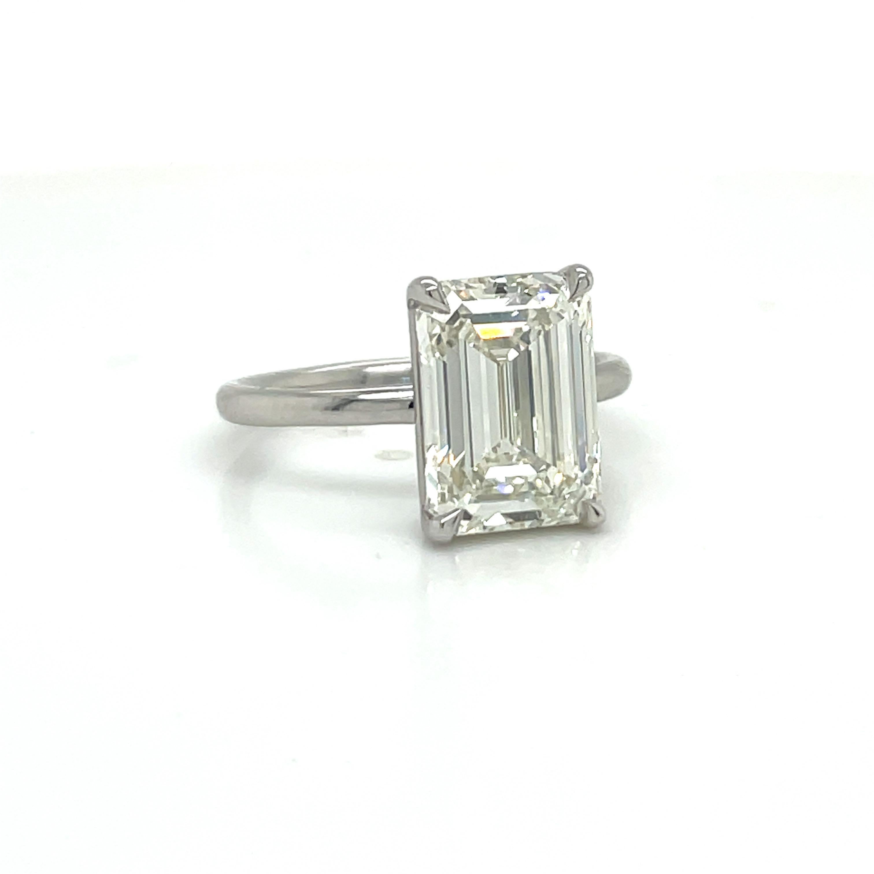 GIA Certified Emerald Cut solitaire engagement ring featuring a 5.01 Carat center, Color K, Clarity VVS2 on a Platinum mounting.
The beauty about this diamond is that it looks like a 6 Carat. There is not one diamond in the world with these