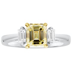 GIA Certified 1.63 Carats Emerald Cut Yellow Diamond Three-Stone Engagement Ring