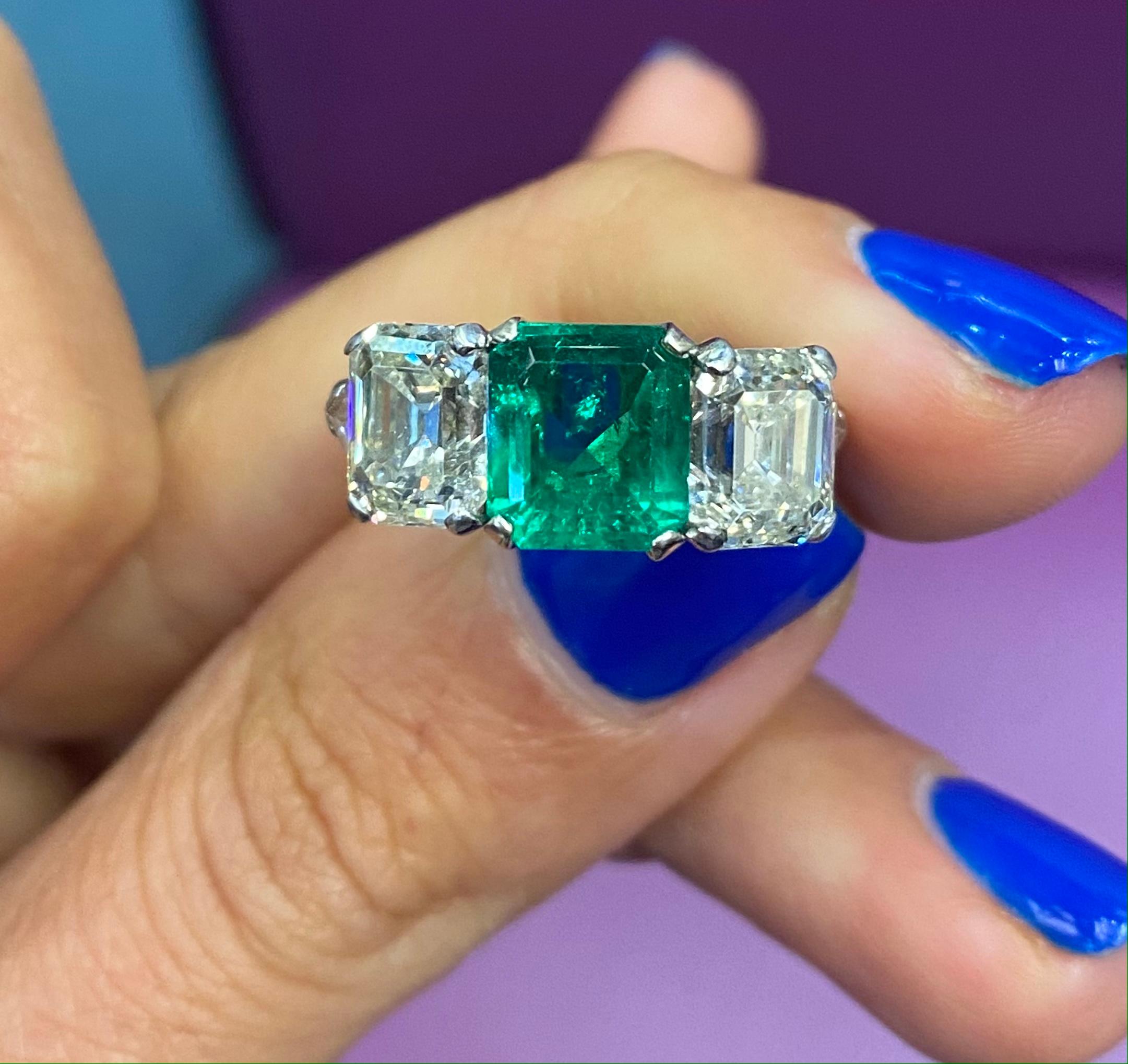 GIA Certified Emerald & Diamond Three Stone Ring
Emerald Weight: 2.24 Cts 
Two Diamonds Weight: 3.50 Cts
Ring Size: 4.5
Re sizable to any size free of charge 
Platinum


