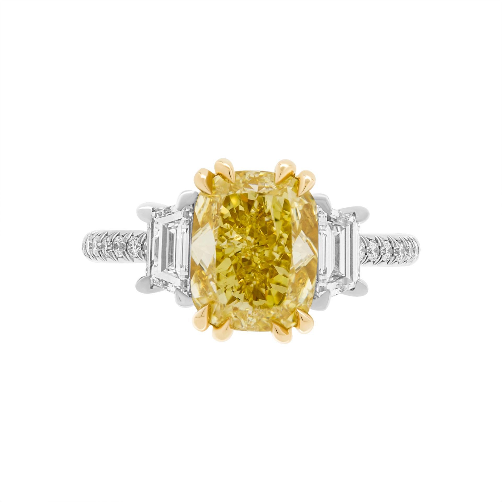 GIA Certified Engagement Ring with 3.01ct Fancy Yellow SI1 Cushion Diamond
Center stone: 3.01ct Natural Fancy Yellow Even SI1 Cushion shape diamond GIA#5221725333 
Side stone: 0.63ct F VS trapezoids 
Cathedral Pave shank, diamond bridge, wrap under