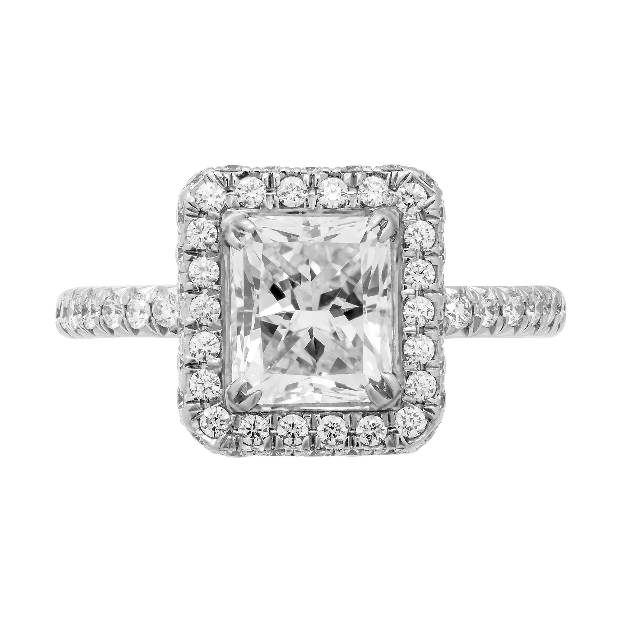 Mounted in handmade custom design setting featuring Platinum 950, diamond shank, fully encrusted gallery under center stone, a true piece of art
Double halo around center stone makes it appear larger and exclusive. Setting features exceptional pave