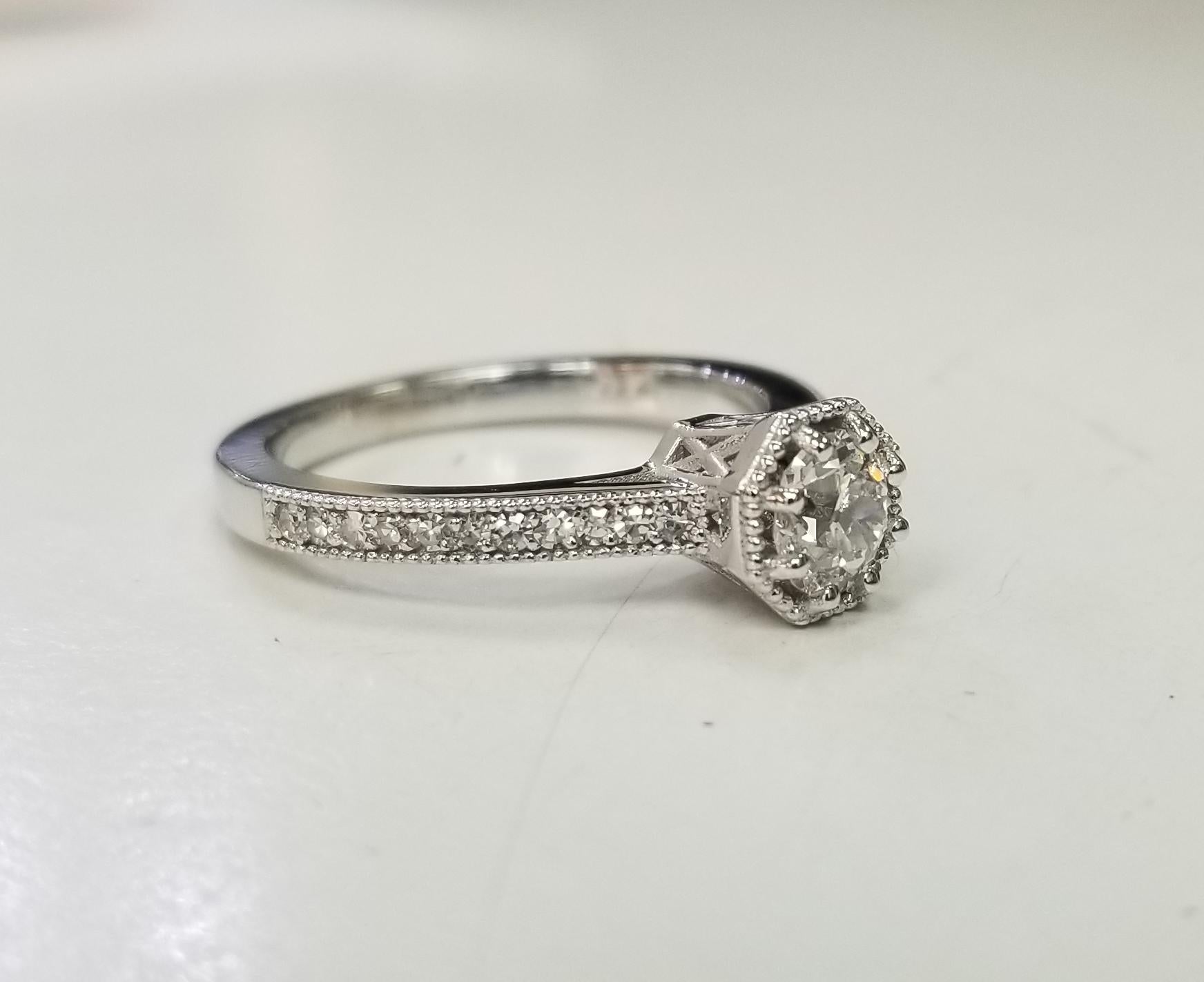 Specifications:
    main stone: GIA Certified Euro Cut .55 CARAT (GIA #6203553898)
    main stone: Diamond color D and clarity VS2
    carat total weight: .20
      metal: 14k white gold
    type: ENGAGEMENT ring
    weight:  4Grams
    size: 6.75 US
