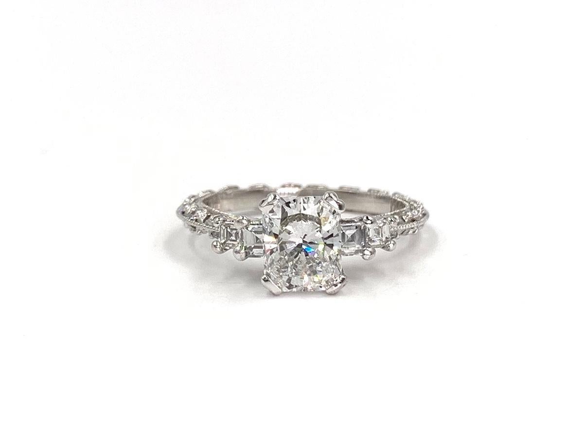 From the iconic TACORI crescent collection a vintage inspired platinum bridal set featuring a 1.21 carat radiant cut diamond center GIA #14439760 F color, VS2 clarity, No fluorescence. Knife edge engagement ring setting contains .50 carat total