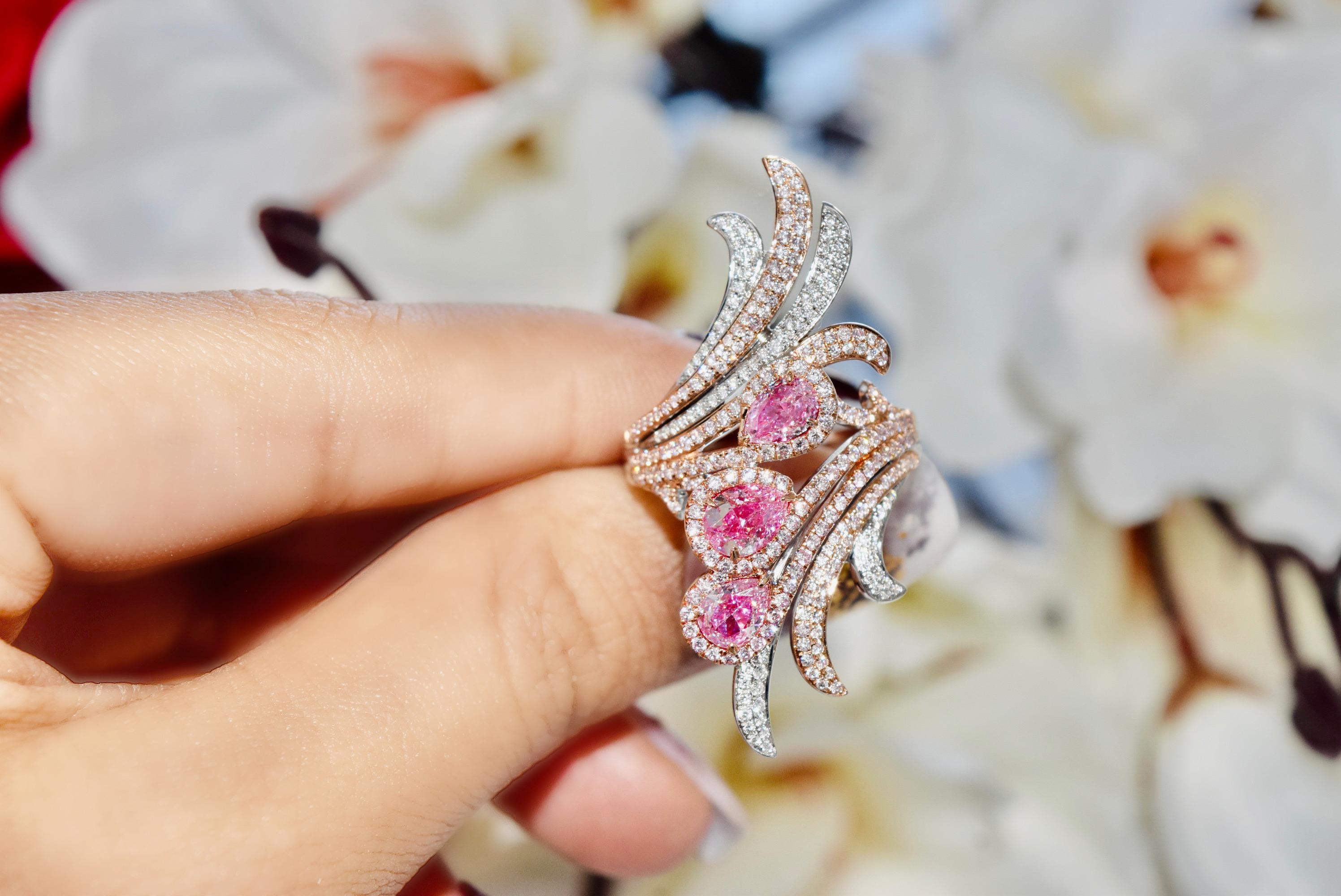 18kt white gold ring with diamonds
  
  Gold colour & karat: White gold 18kt
  Weight: 10.38 grams
  
  Set with-
  Stone type: Diamonds
  Shape: Pear, Pear, Pear
  Carat: 0.41 ct, 0.40 ct, 0.60ct (03 Pcs )
  Colour: Faint Pink, Faint Pink, Faint