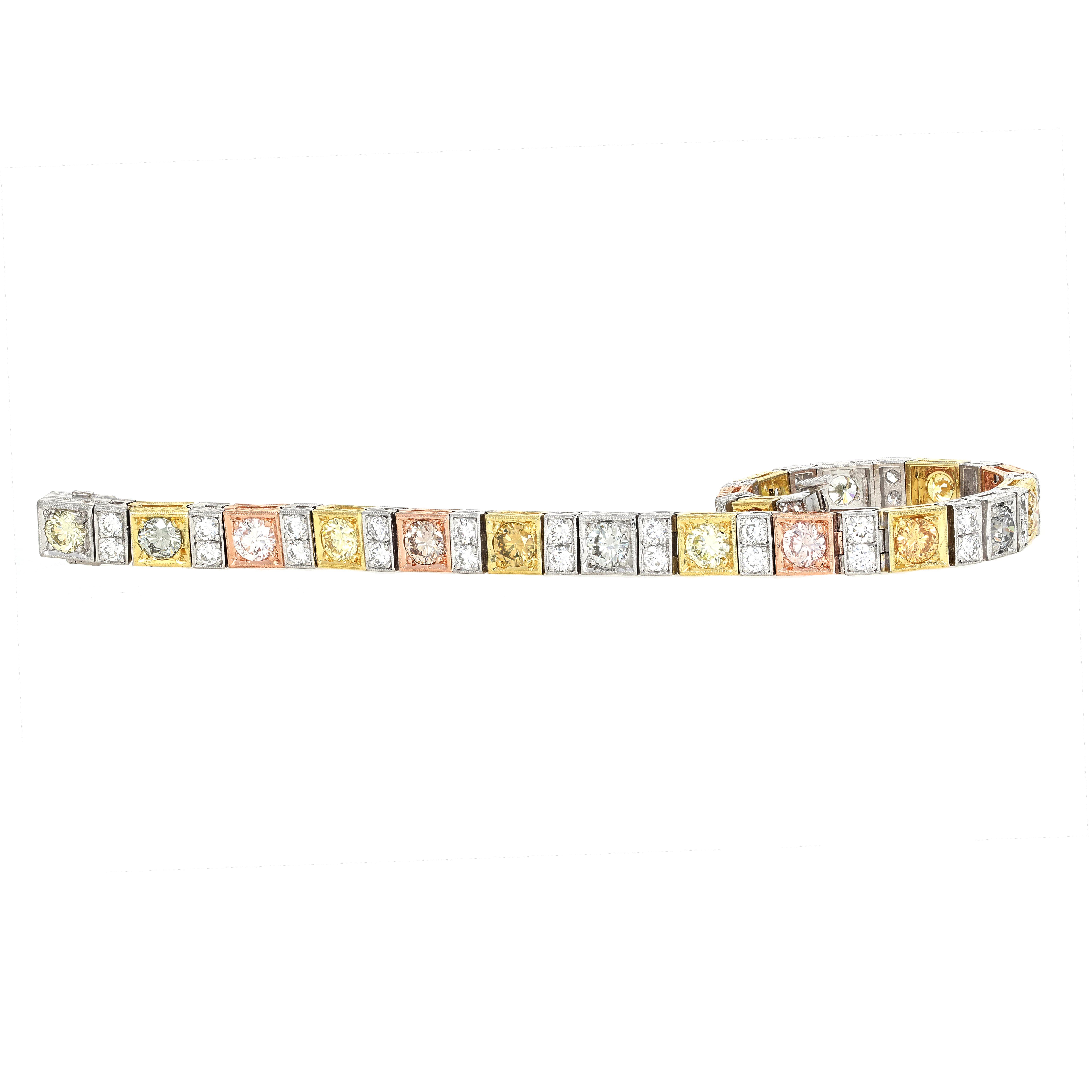 Handmade fancy color diamond tennis bracelet set in 18 karat white, yellow and rose gold. One of the most rare and unique tennis bracelets you will find. All of the center stones are GIA certified and measure between 0.32 carats and 0.48 carats.