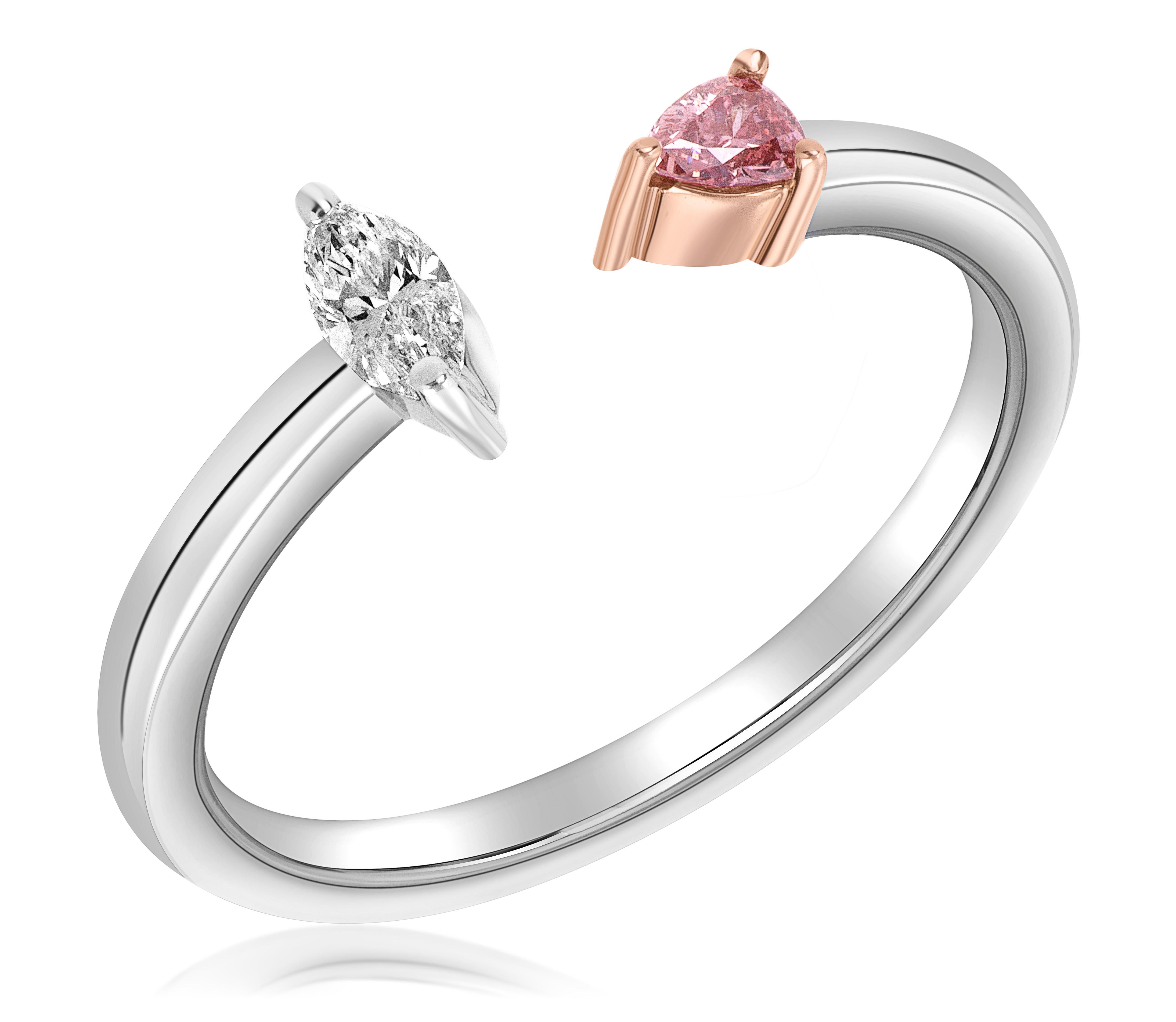 Handmade ring featuring a natural fancy deep pink pear weighing .09 carats, GIA#: 5211437481. Accented by a 0.13 F color, VS2 clarity marquise diamond. Ring size is 6.5. 
