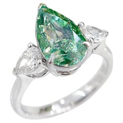 Anillo de tres piedras de oro de 18 quilates con diamante amarillo verdoso grisáceo de fantasía certificado por GIA