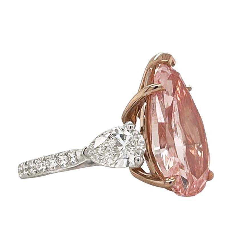 An engagement ring fit for a Queen, this stunning Fancy Intense Pink Brilliant diamond with a whopping 7.51 carats, VVS1 clarity is delicately and expertly mounted over 18k rose gold as to accentuate the pink glow from this incredible stone.
The