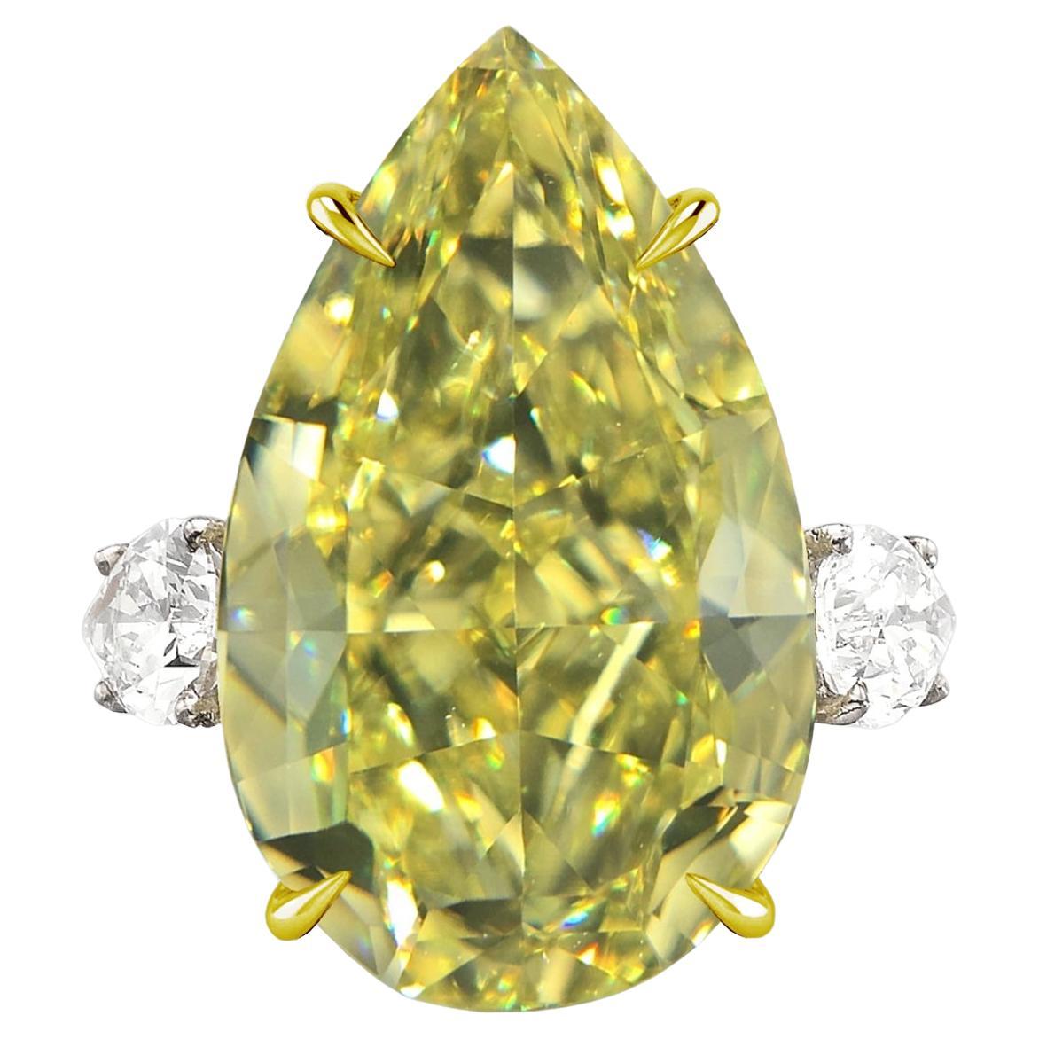 GIA Certified Fancy Intense Yellow 10 Carat Pear Shape Three Stone Diamond Ring