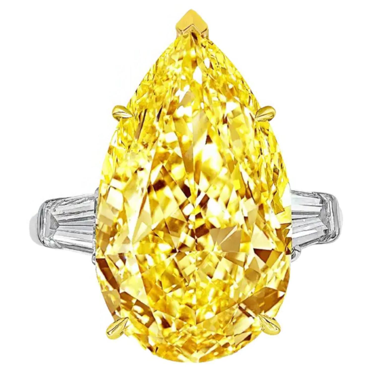 Modern GIA Certified Fancy Intense Yellow 13.8 Carat Pear Cut Diamond Ring For Sale