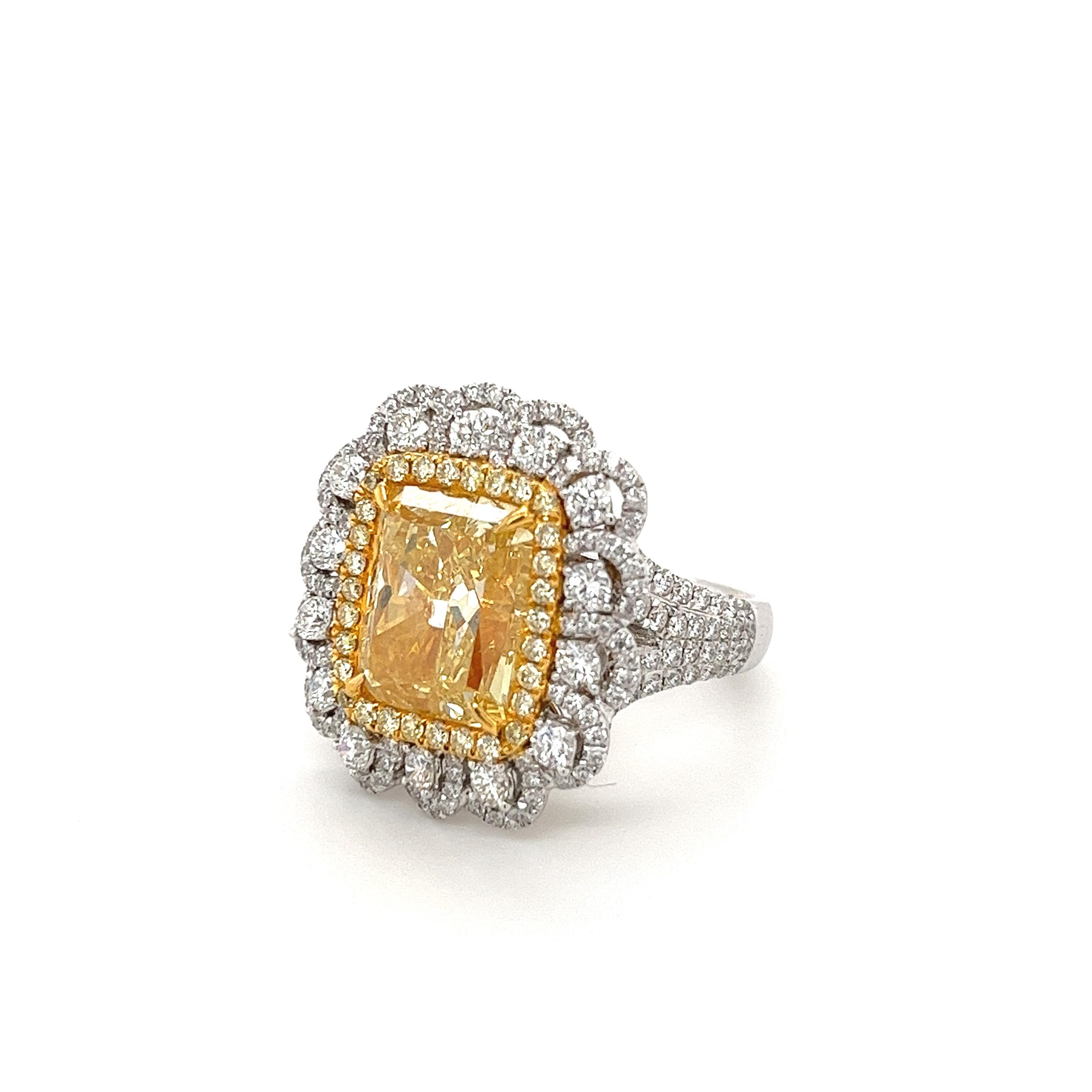 GIA Certified Fancy Intense Yellow 7 Carat Radiant Cut Diamond Ring in 18k Gold In New Condition For Sale In Miami, FL