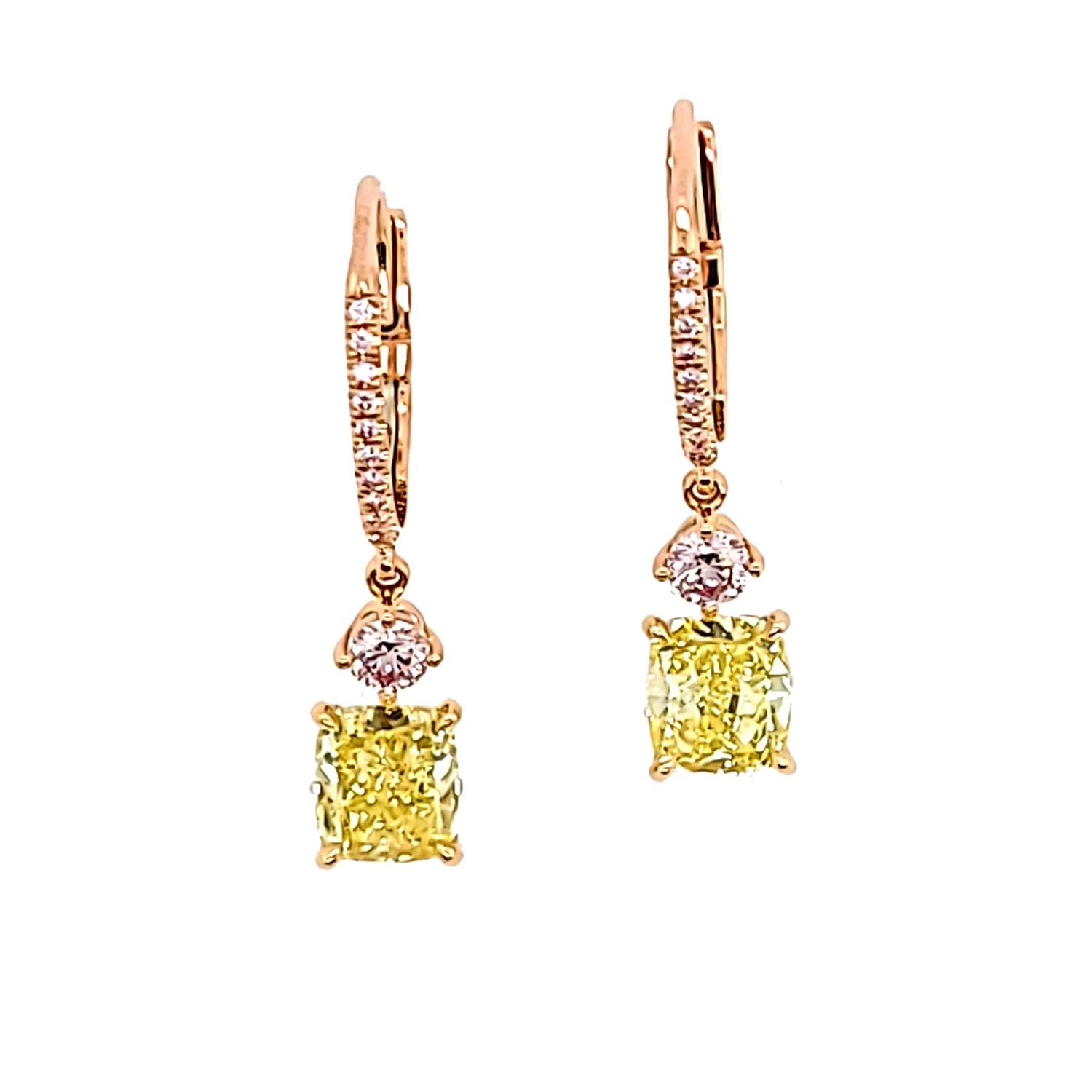 Make a statement with these stunning handmade drop earrings! These earrings feature two fancy intense yellow cushions, weighing 2.52 carats total, set in 18k yellow gold. The cushions are certified by the esteemed GIA, with unique numbers 2165301327