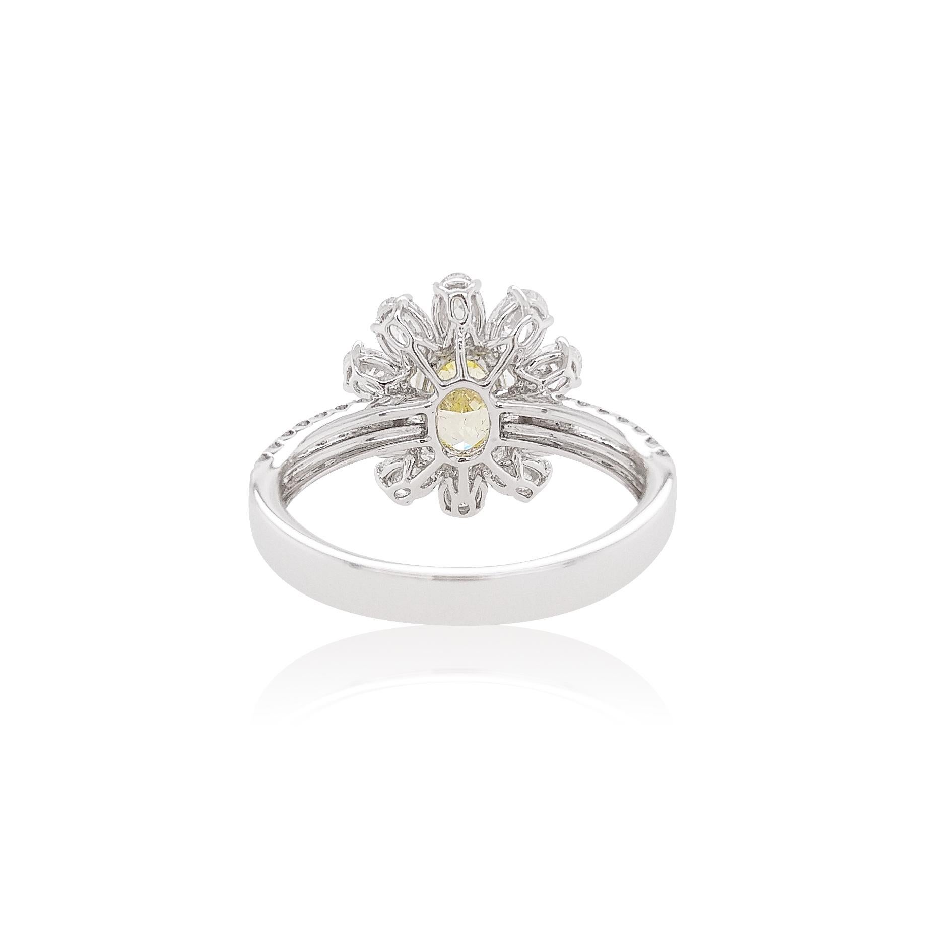 This enchanting ring features a lustrous Fancy Intense Yellow Diamond at its centre, with delicate oval shape white diamonds halo surrounding it. Set in Platinum to enrich the spectacular hues of the Yellow Diamond and the sparkle of the White