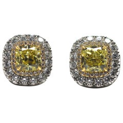 GIA Certified Fancy Intense Yellow Diamond Earrings Mounted in Platinum and Gold